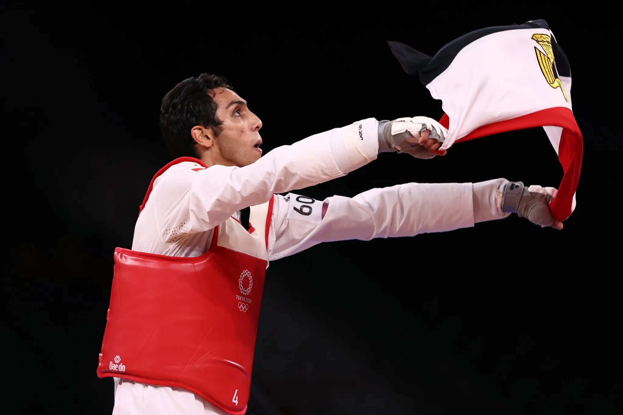 Seif Eissa Holding Egyptian Flag After Winning Taekwondo Medal