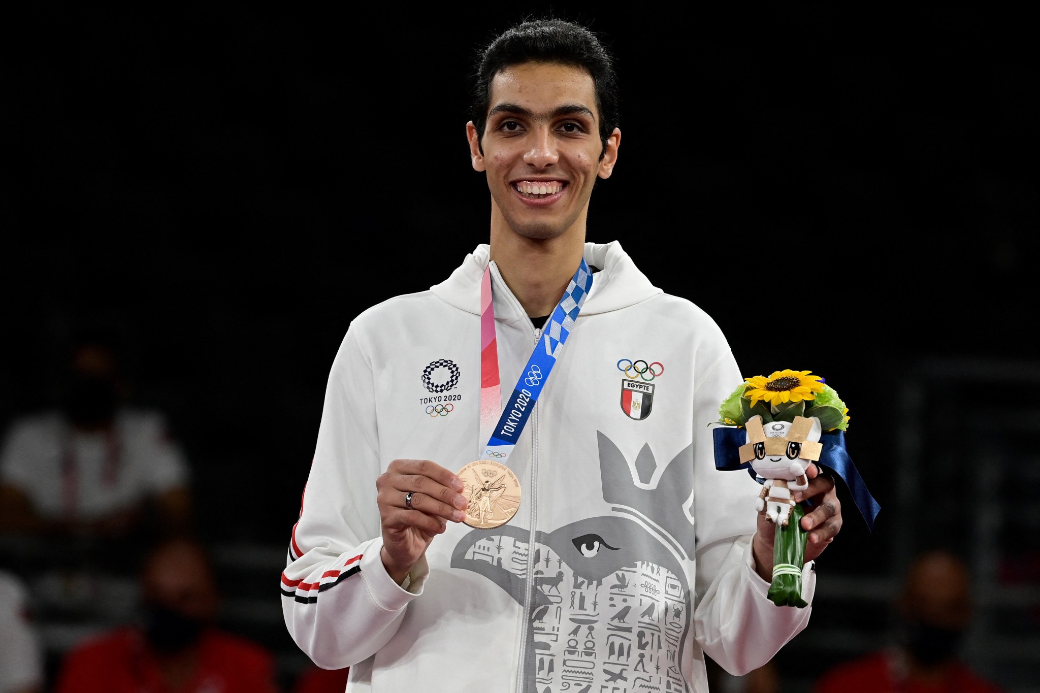 Seif Eissa Smiling with Olympic Bronze Medal and Mascot