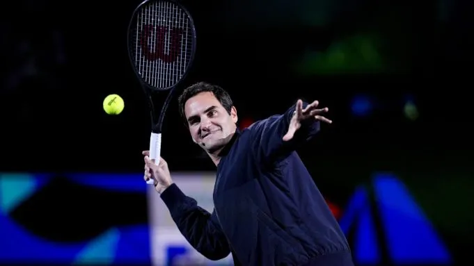 Federer Celebrates in Dramatic Lighting