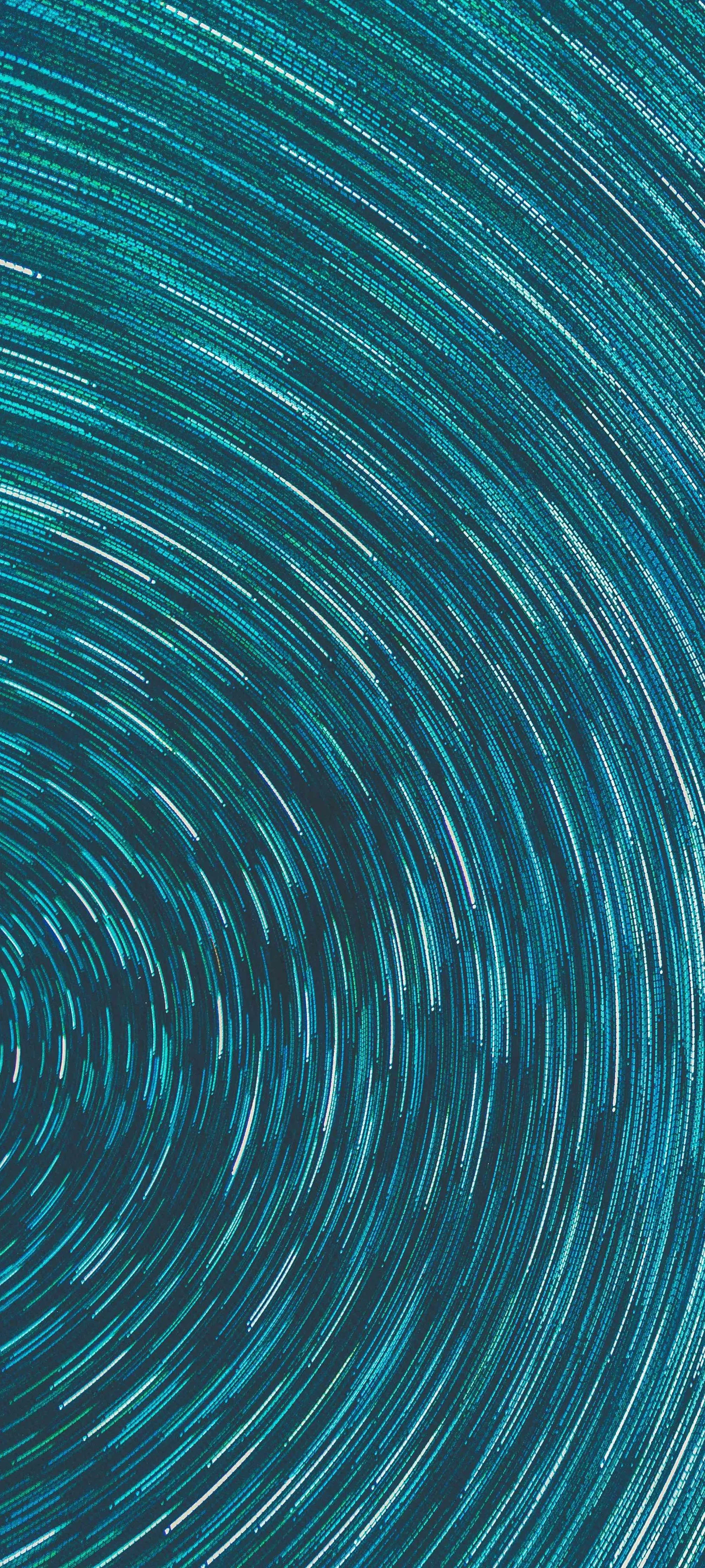 Abstract Spiral Pattern in Blue and Aqua Tones Wallpaper