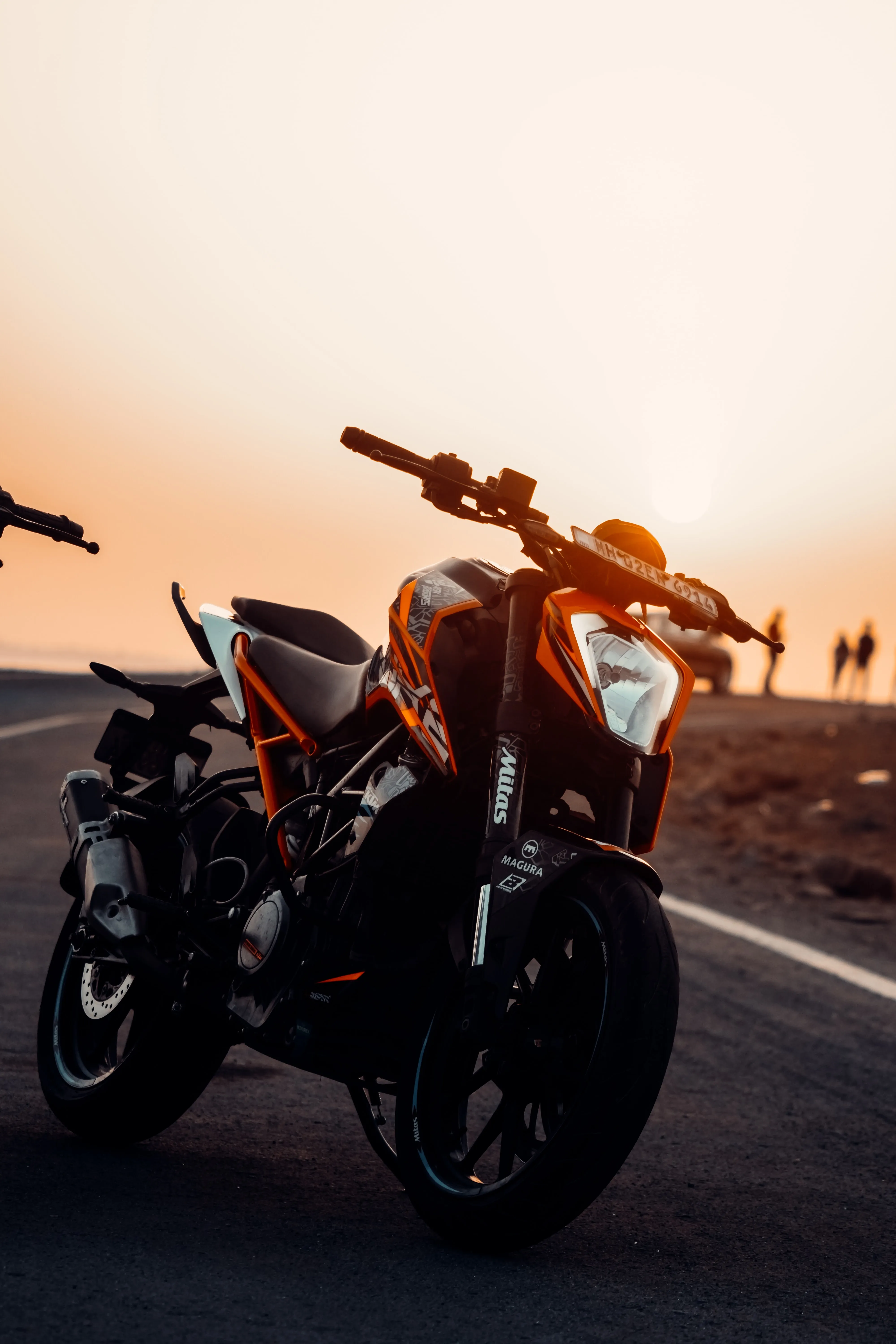 Adventure Motorbike Parked Under Sunset Light Wallpaper