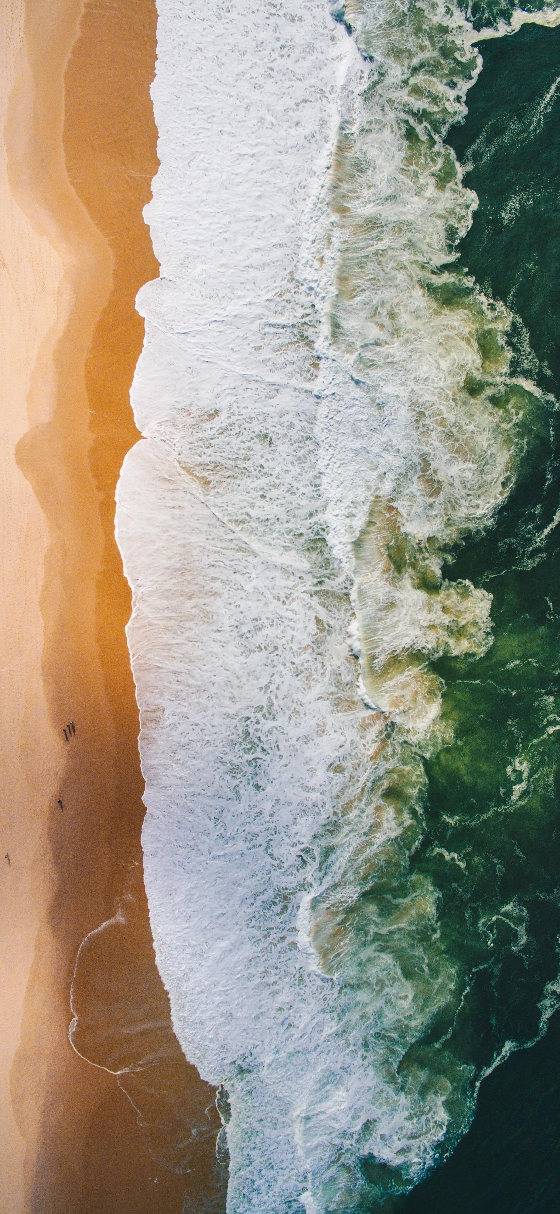 Aerial Beach View with Ocean Waves and Sandy Shore