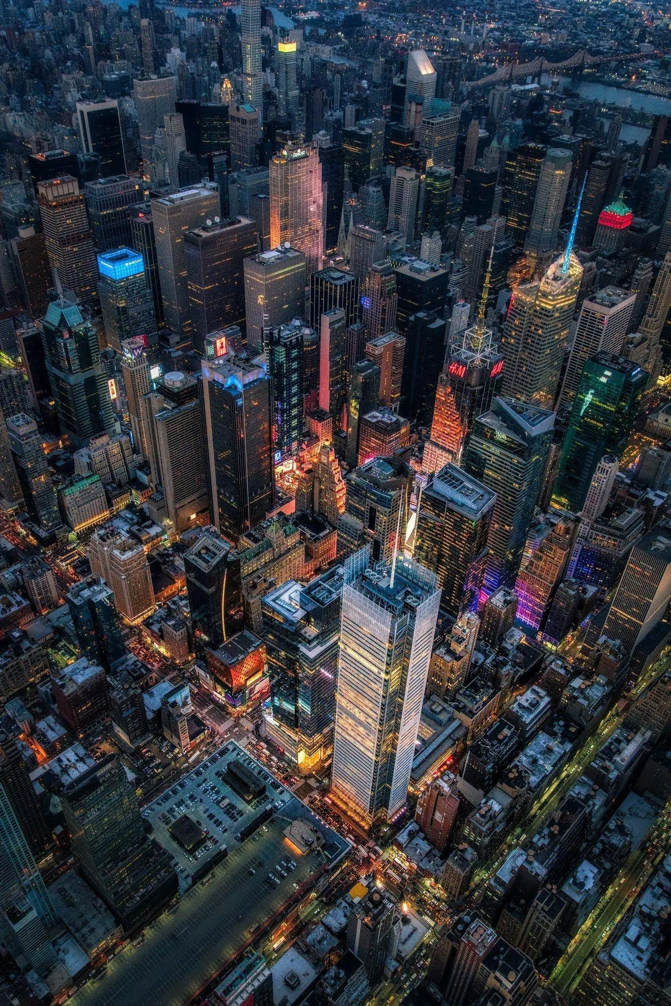 Aerial Cityscape Revealing Dense Towers and Glowing Lights