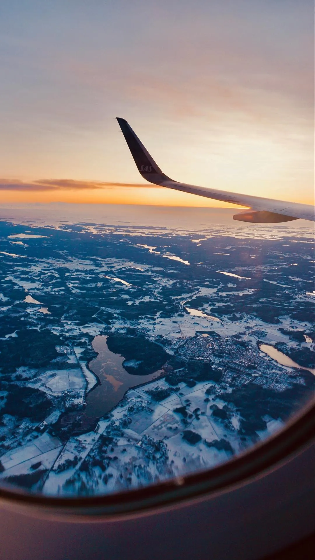 Aerial View from Airplane Window Over Beautiful Clouds
