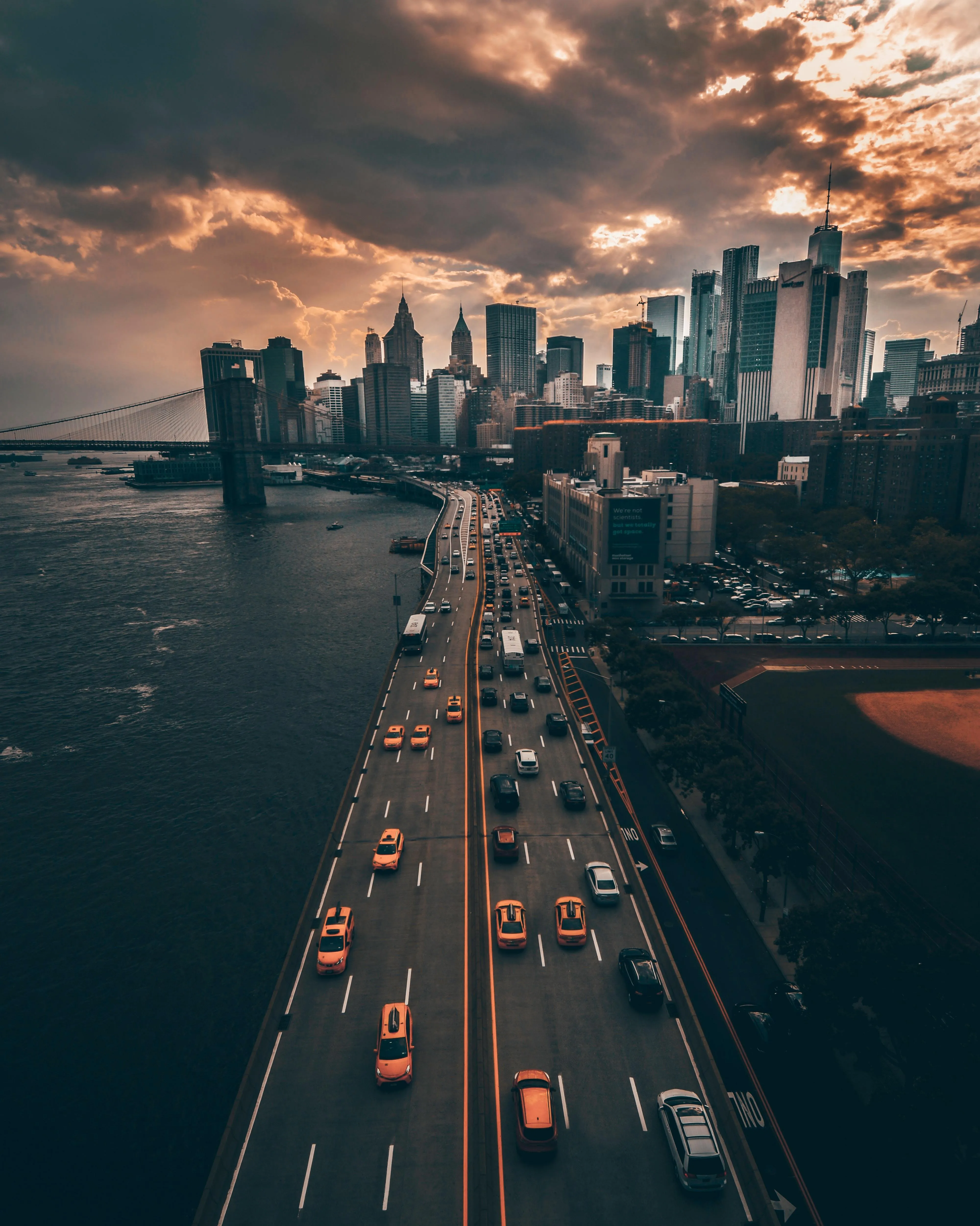 Aerial View of Busy Bridge Leading To a Modern Cityscape