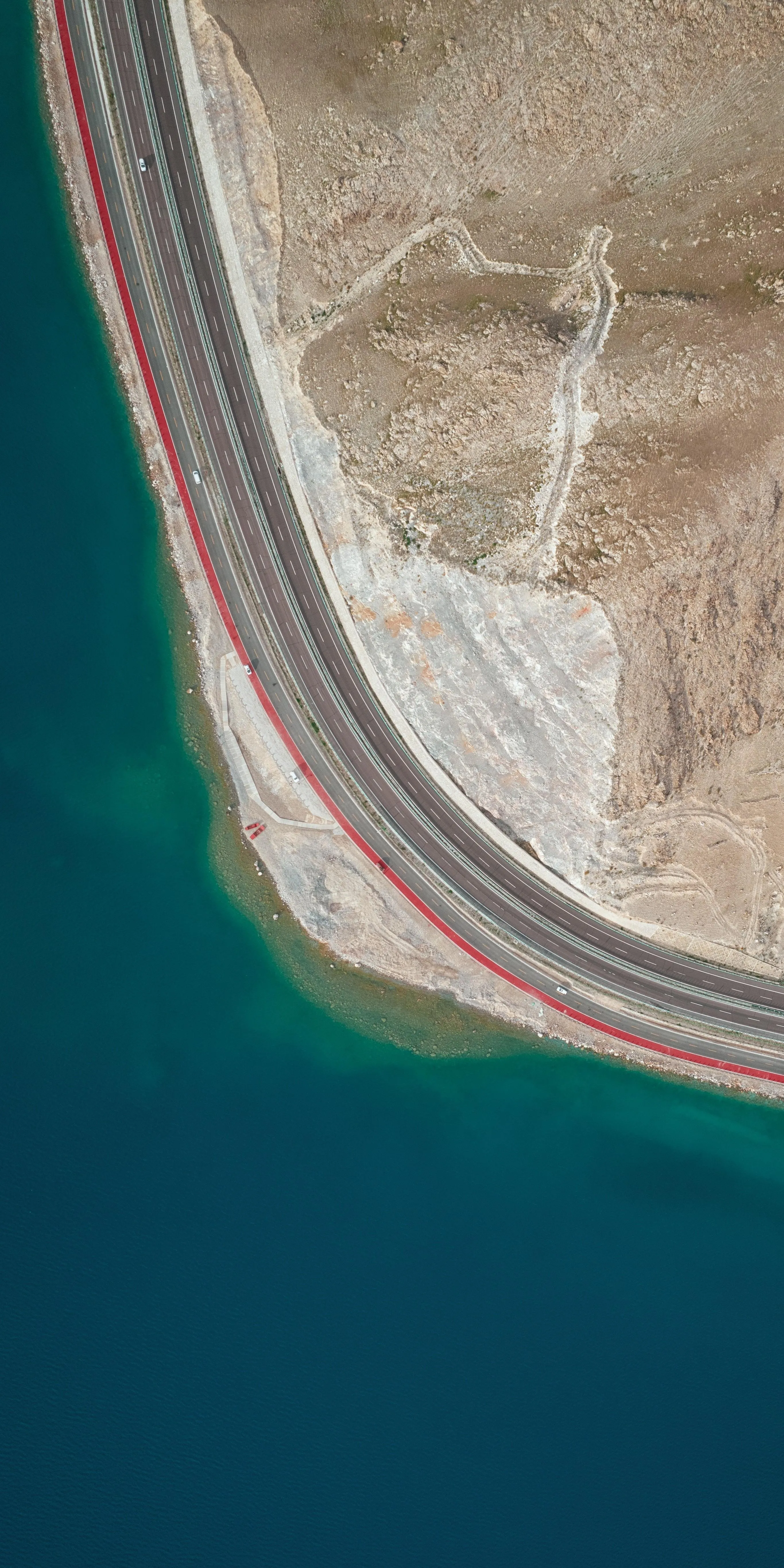 Aerial View of Coastal Beach and Ocean Waves Wallpaper