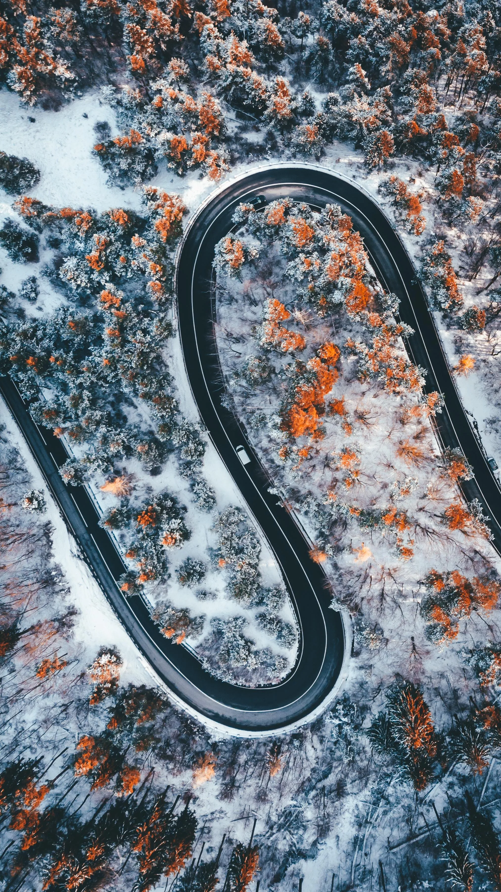 Aerial View of Curvy Road in Snowy Mountain Landscape Image