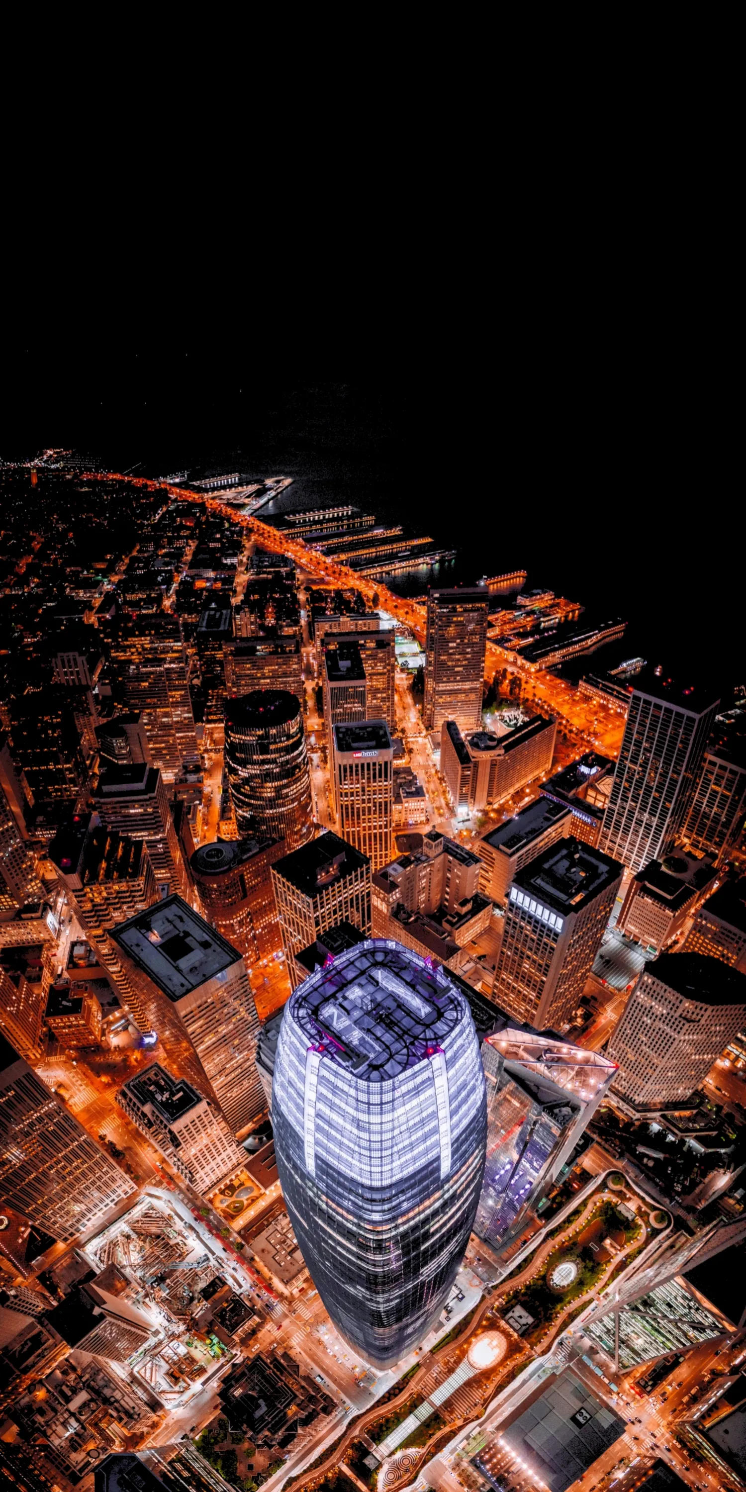Aerial View of Modern City Skyline with Bright Night Lights