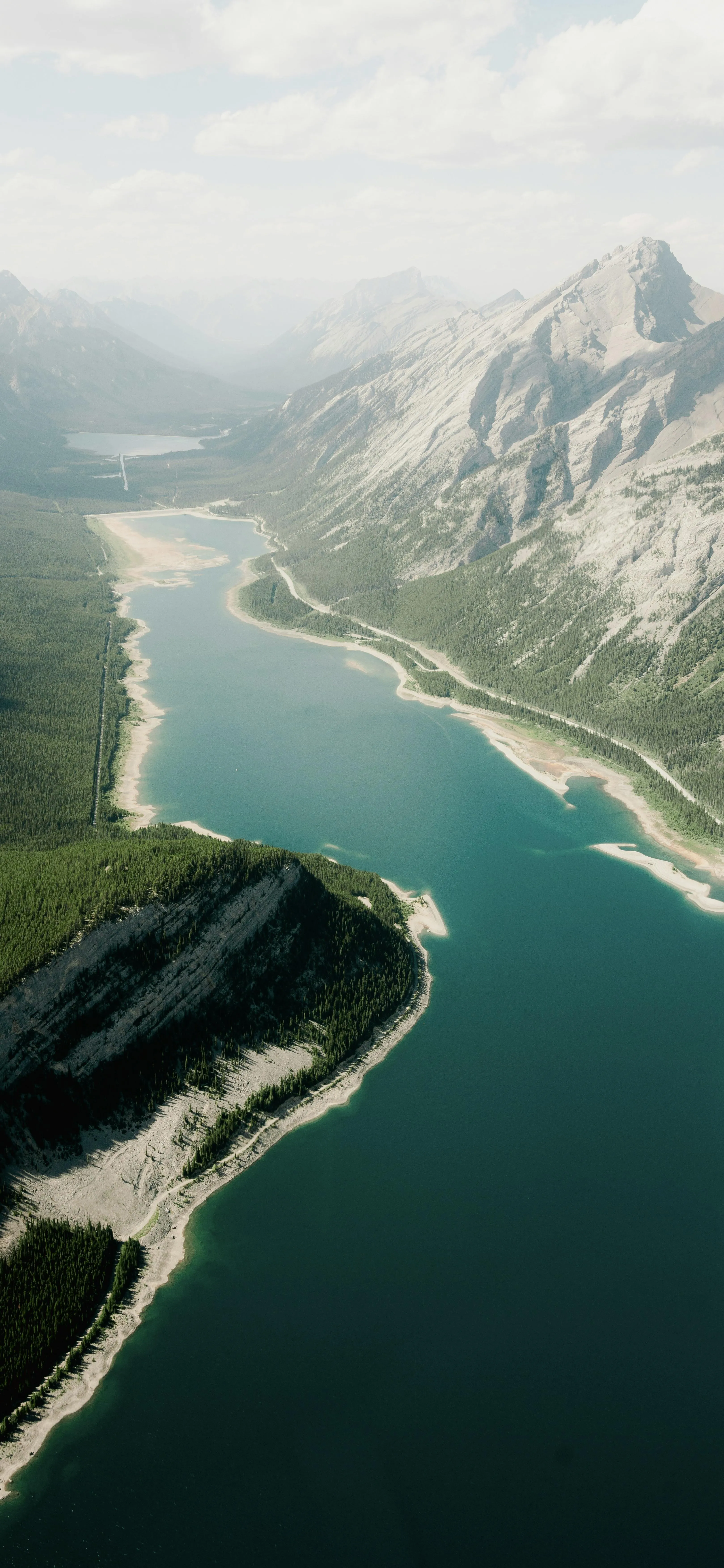 Aerial View of Mountainous Coastline with Clear Water