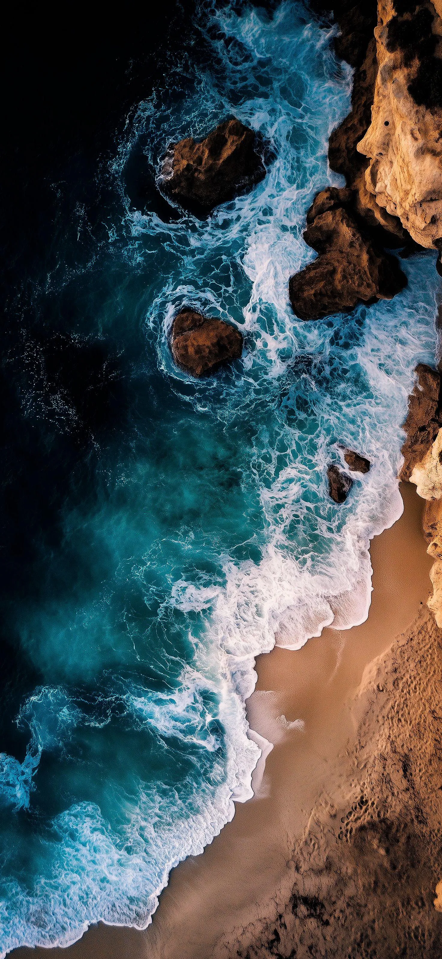 Aerial View of Ocean Waves Crashing Against a Rocky Shoreline