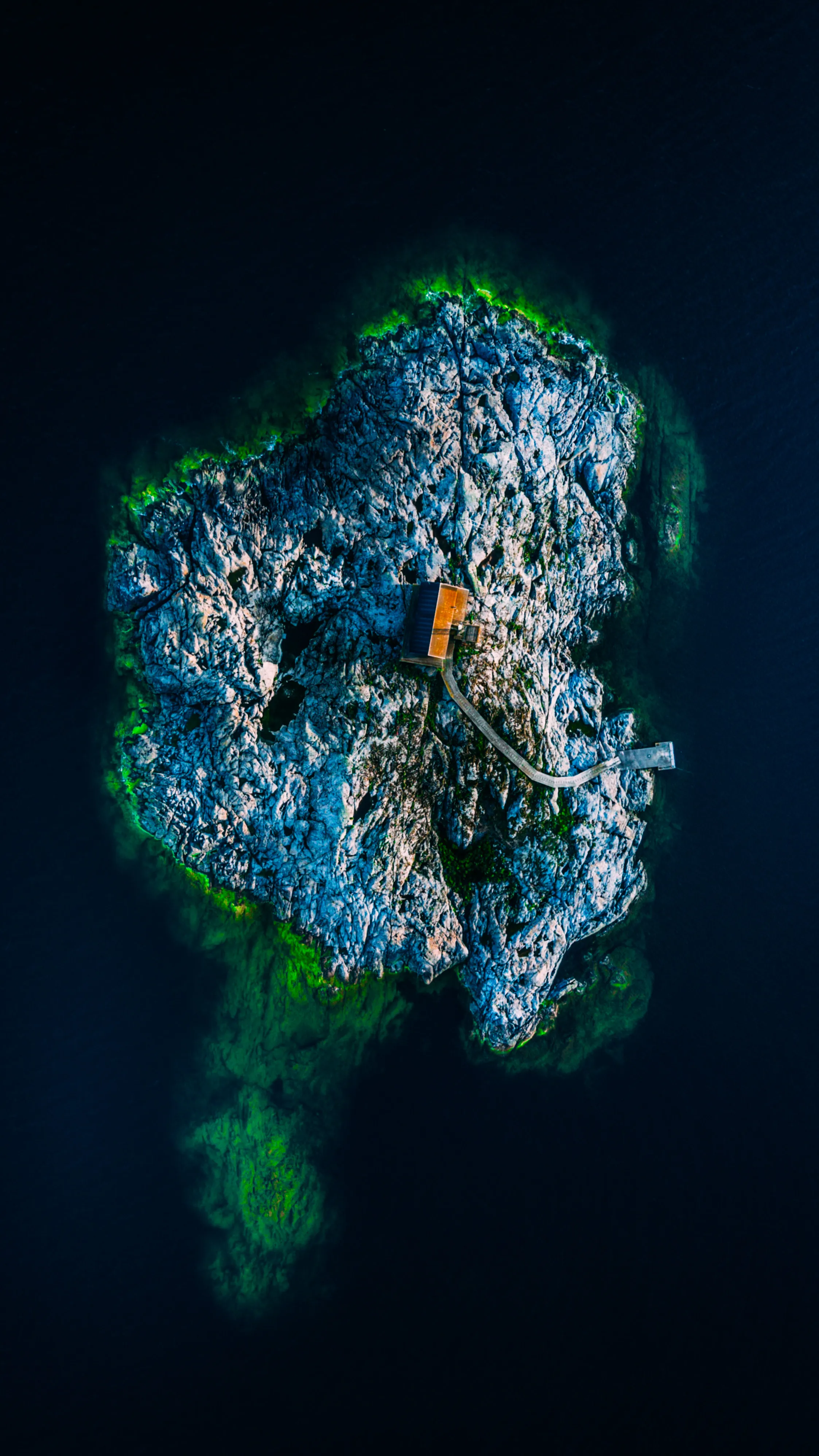Aerial View of Tropical Island Surrounded by Blue Ocean
