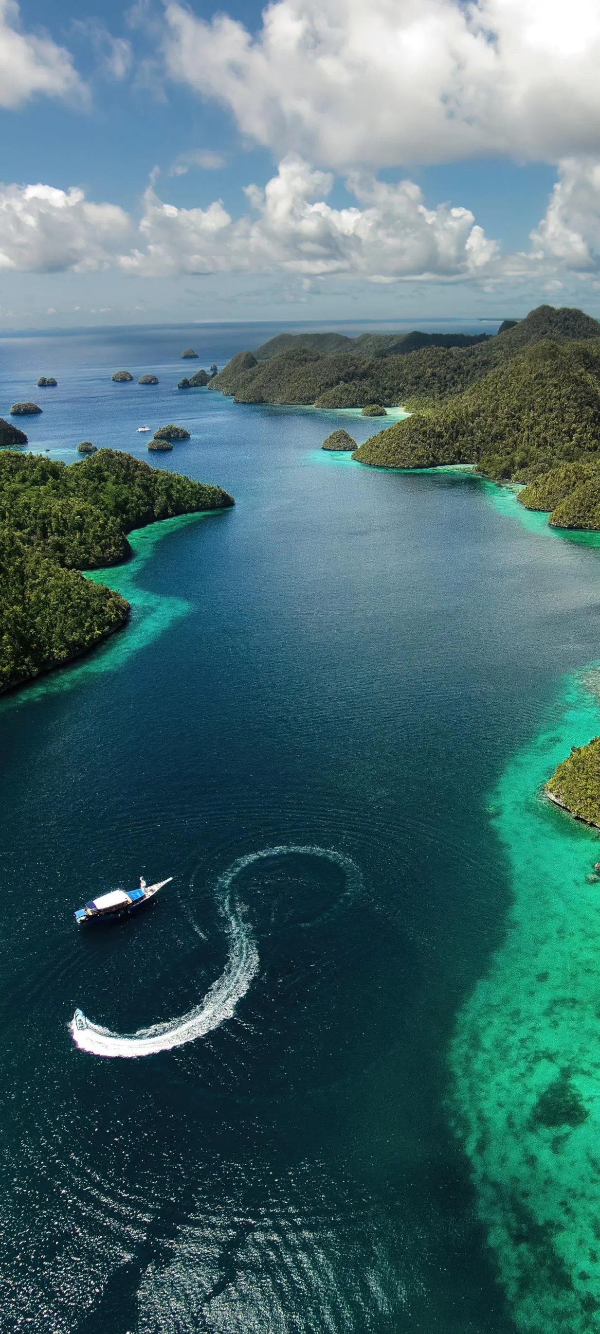 Aerial View of Turquoise Bay and Green Islands Wallpaper