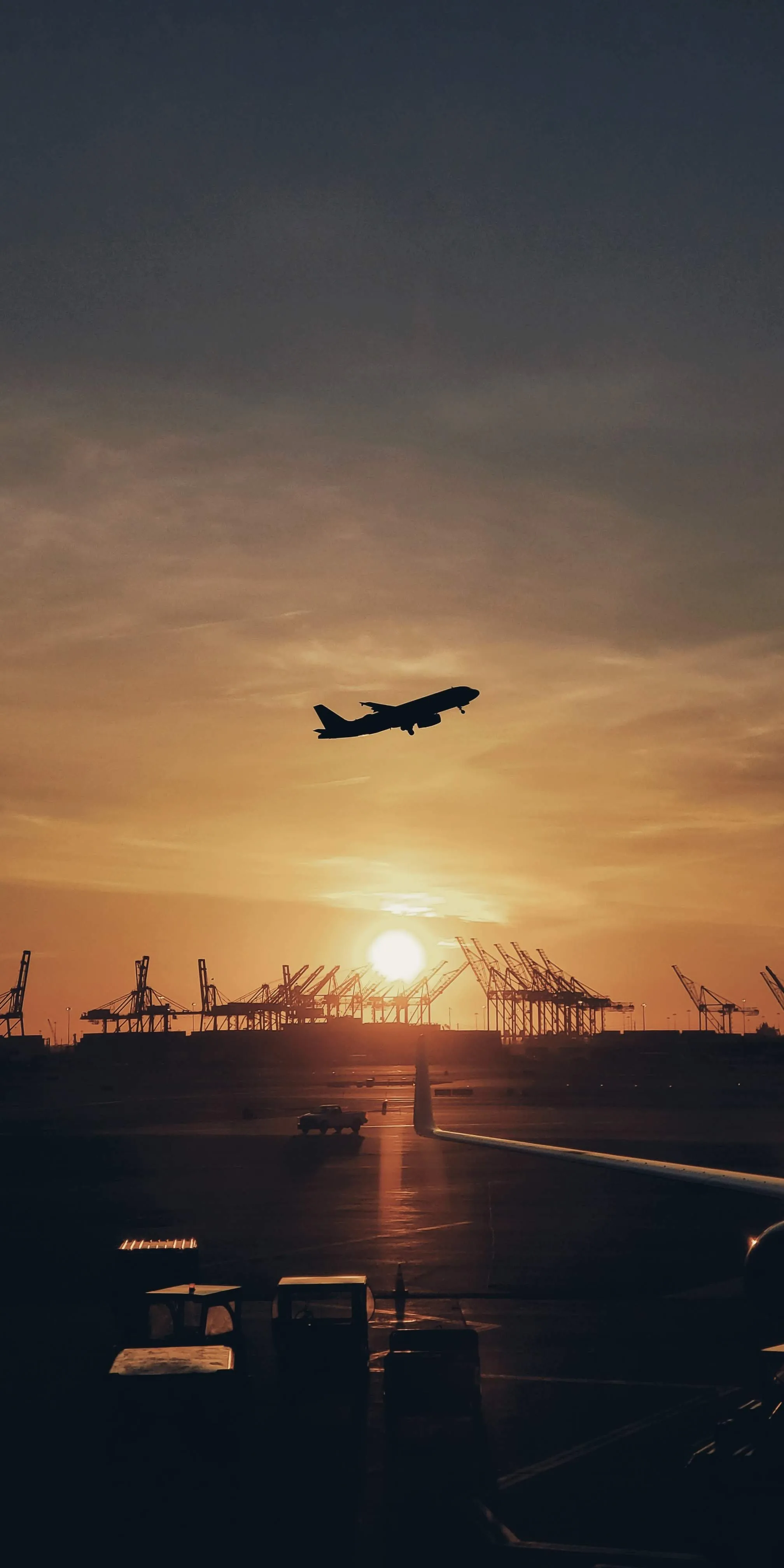 Airplane Flying Through Golden Hour in City Skyline