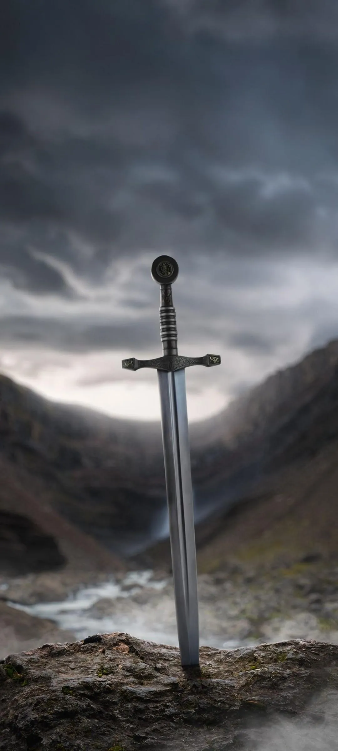 Ancient Sword Standing Alone in Foggy Valley Wallpaper