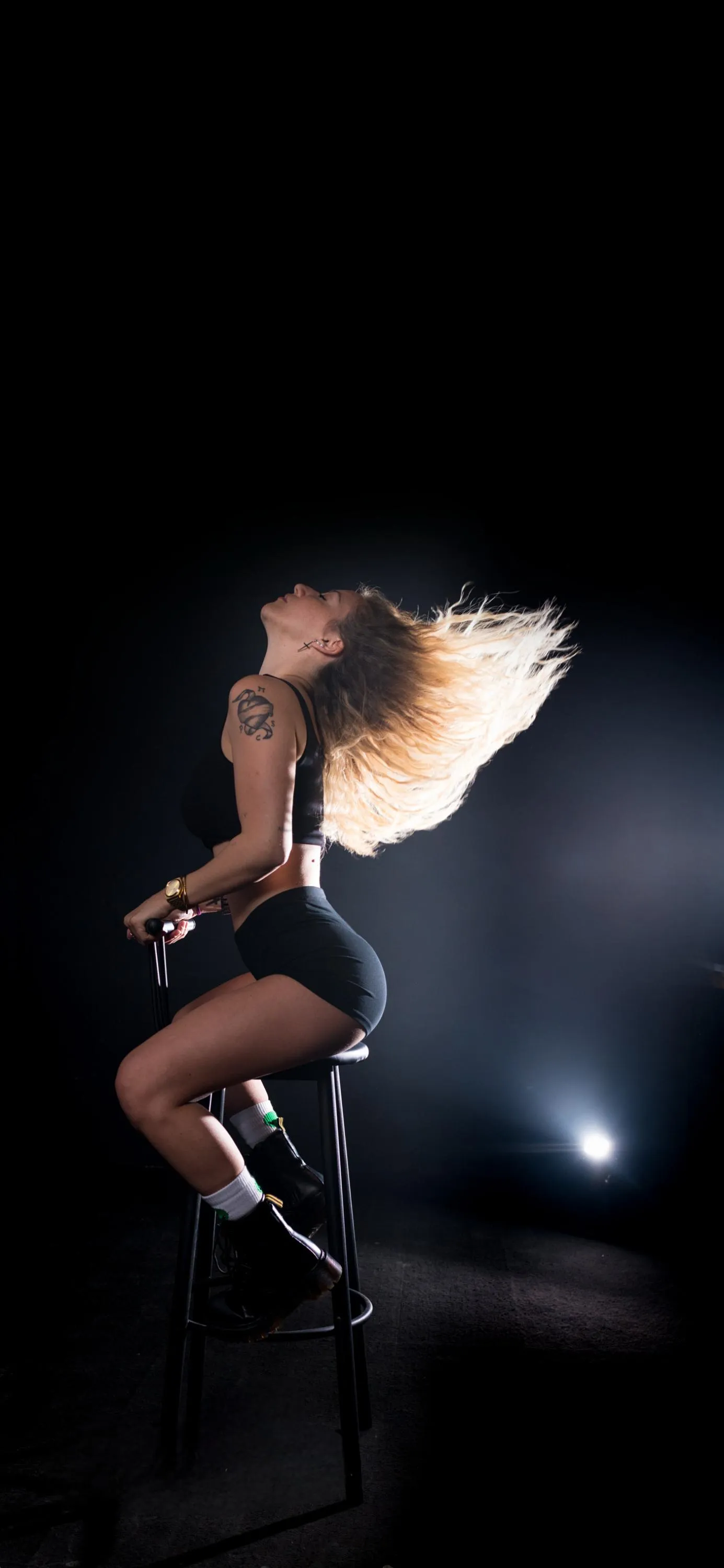 Artistic Woman Dancing with Spotlight Effect Wallpaper