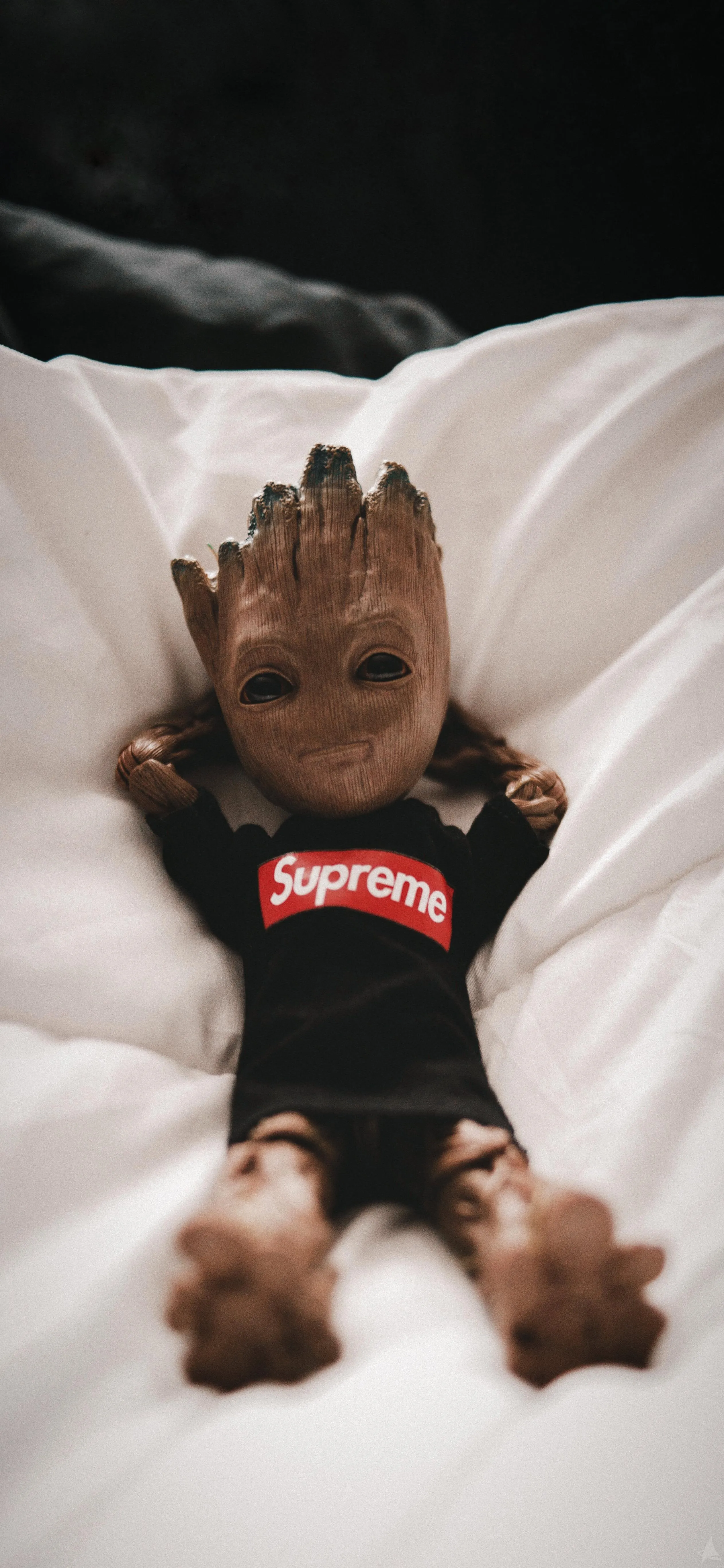 Baby Groot Relaxing in Supreme Shirt on Cozy White Bedding