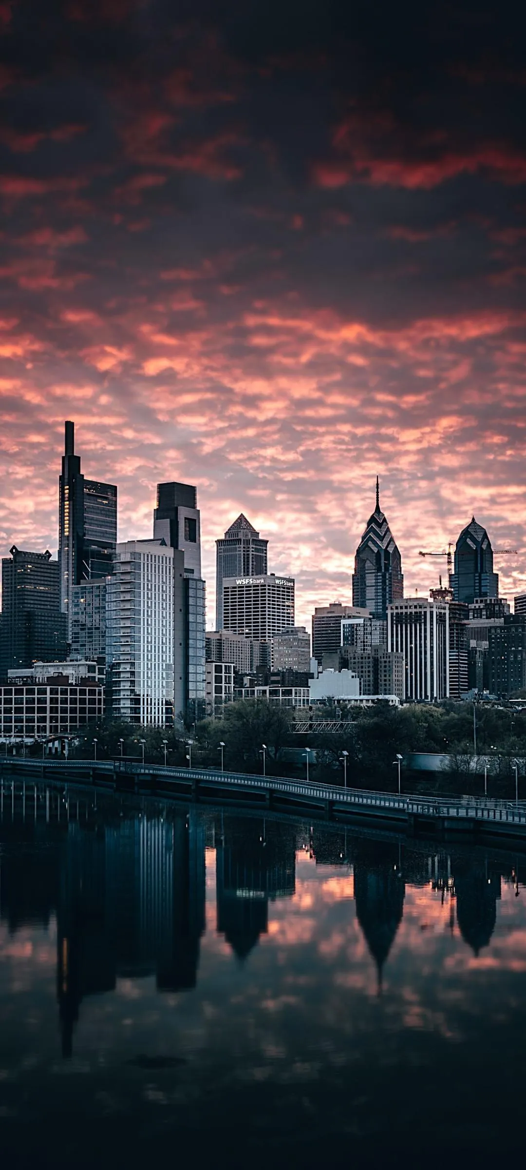 Beautiful City Skyline at Sunset with Vibrant Red Sky