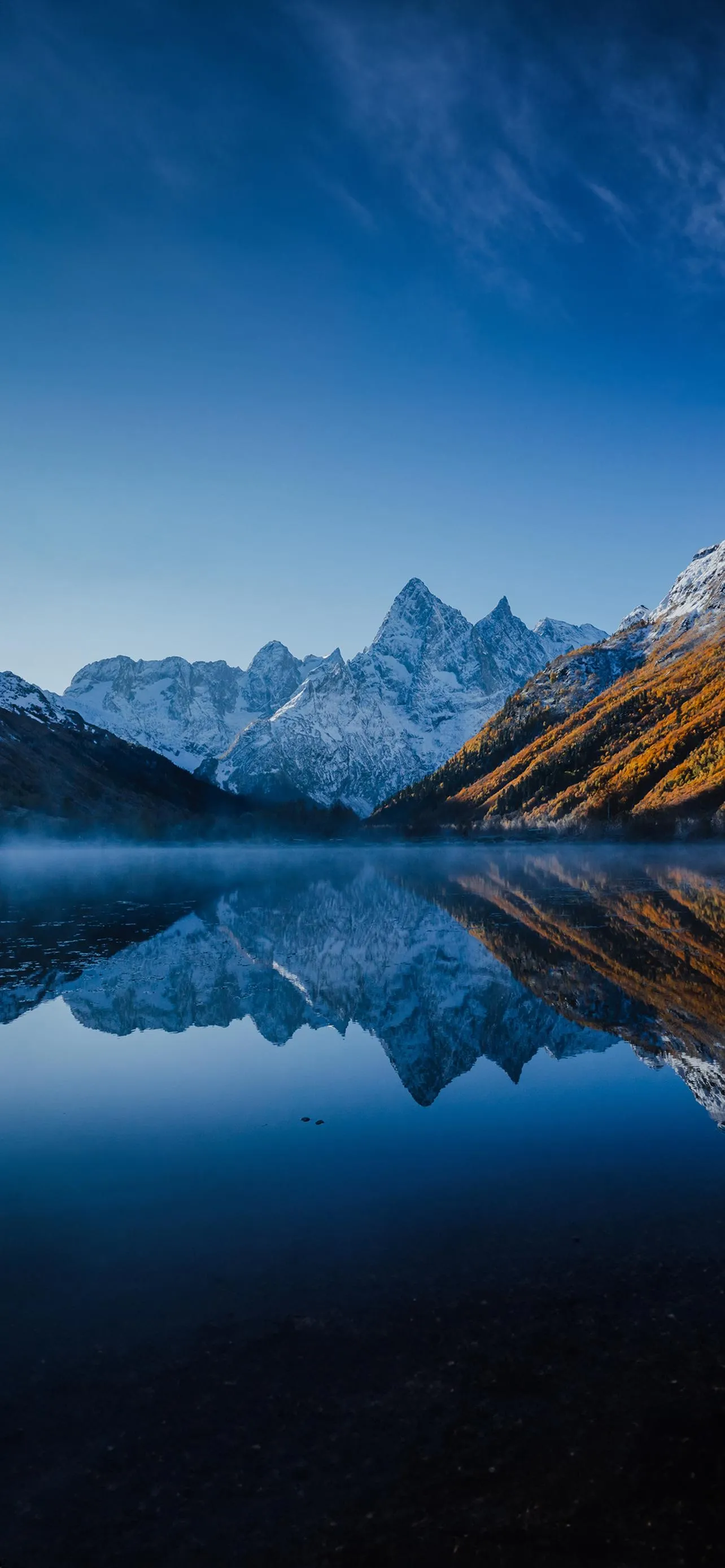 Beautiful Landscape of Snow Peaks and Lake Reflection