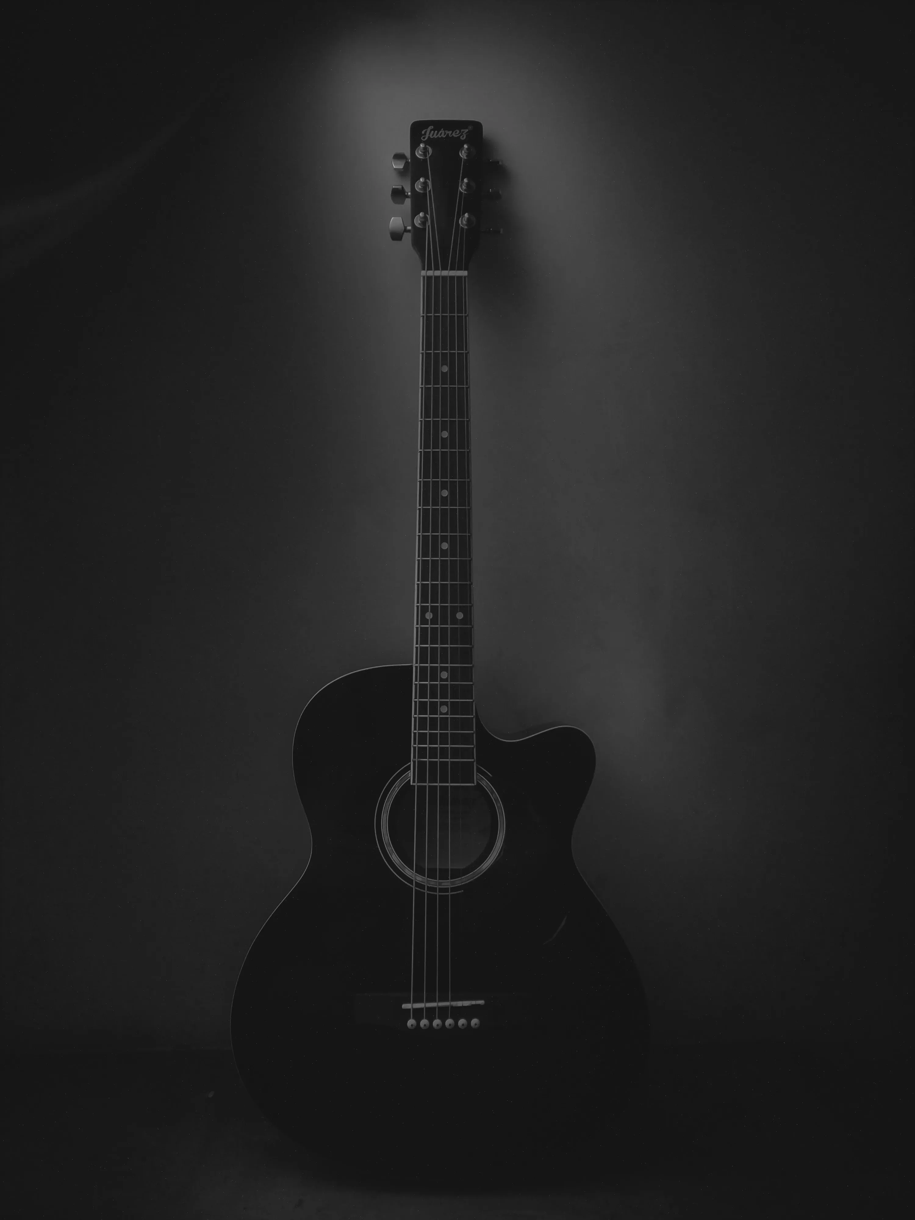 Black Acoustic Guitar on a Dark Background for Iphone