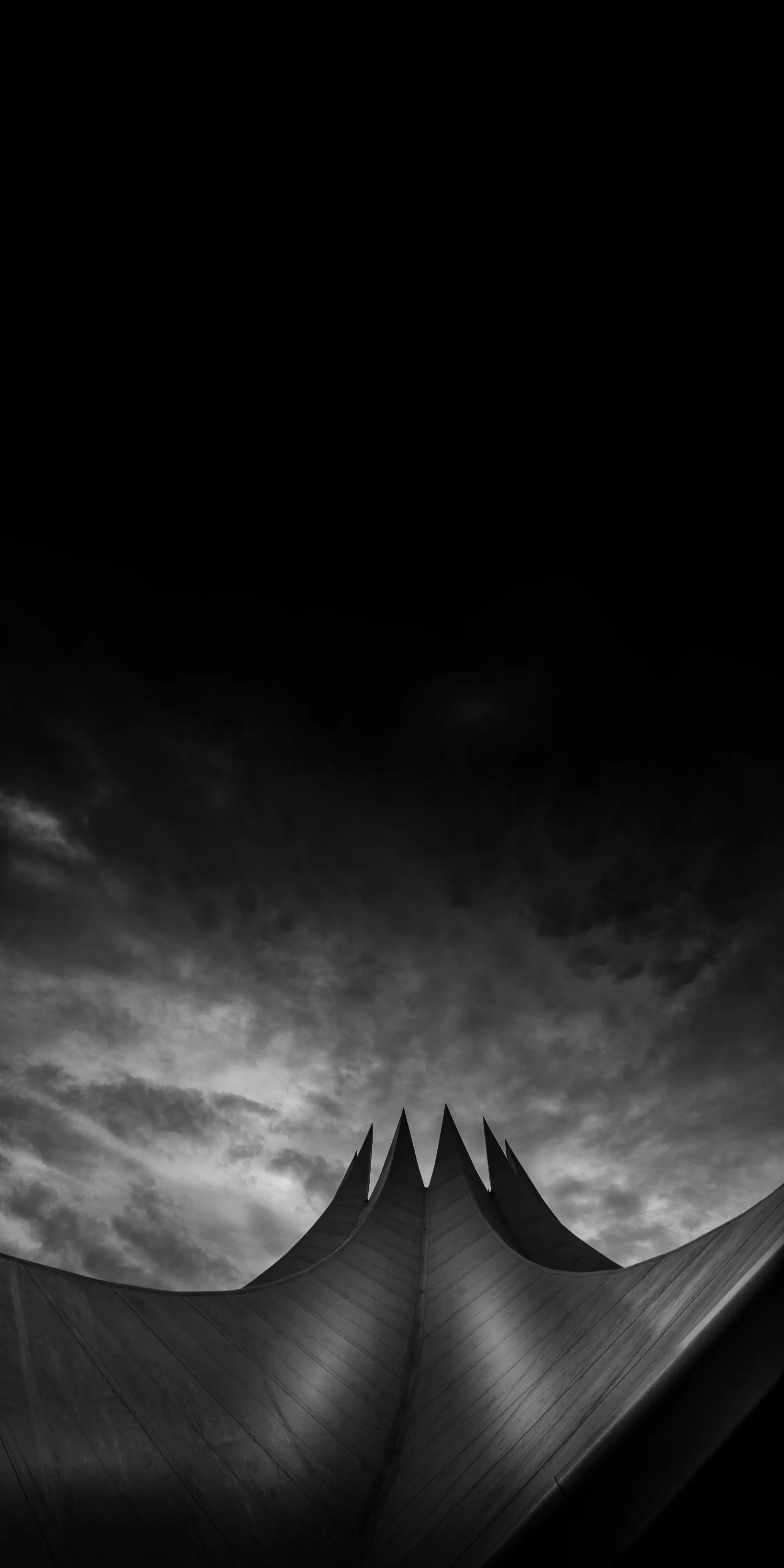 Black and White Building Range Under Dark Sky Wallpaper