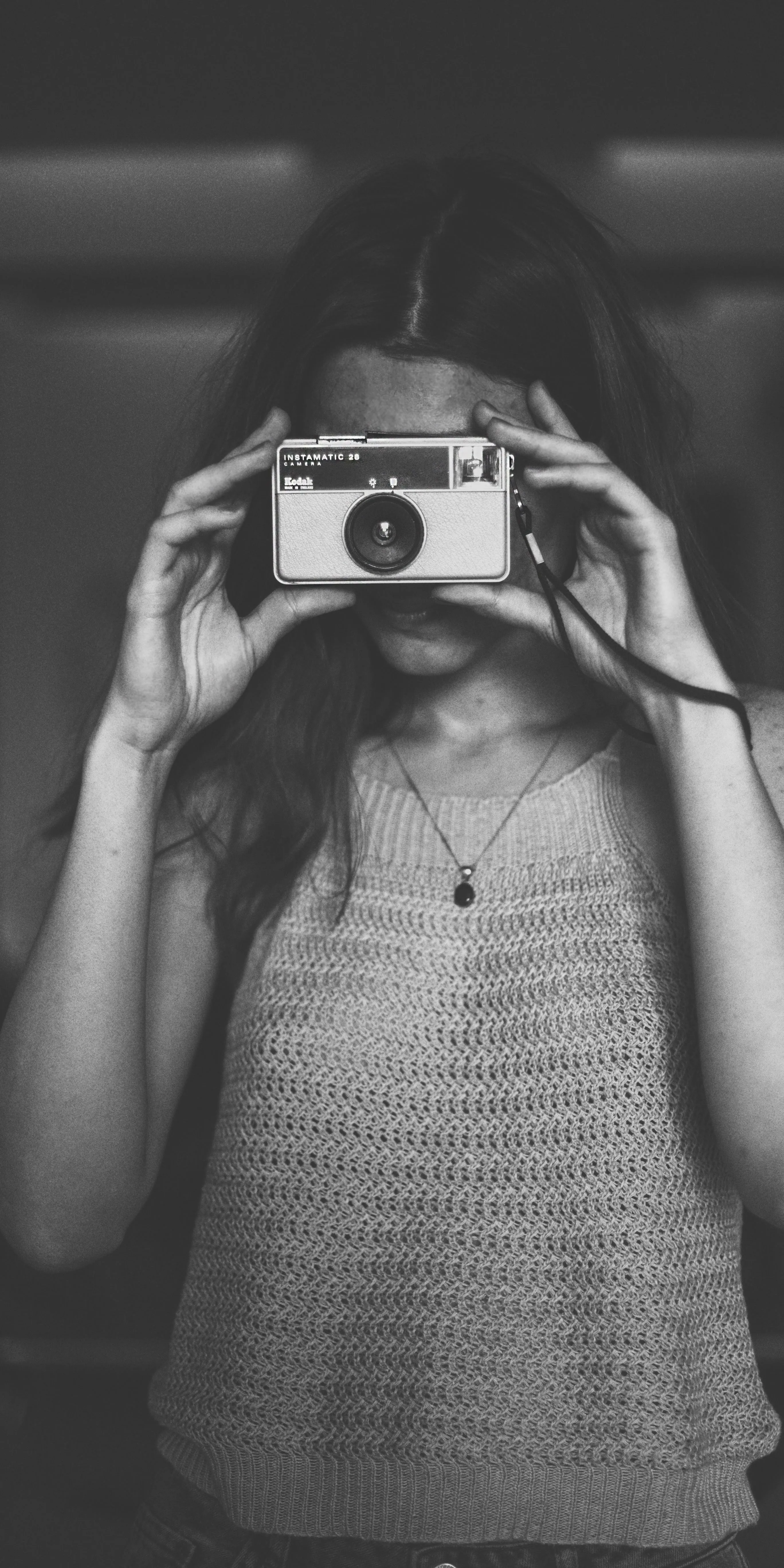 Black and White Girl Holding Old Film Camera Shot Photography