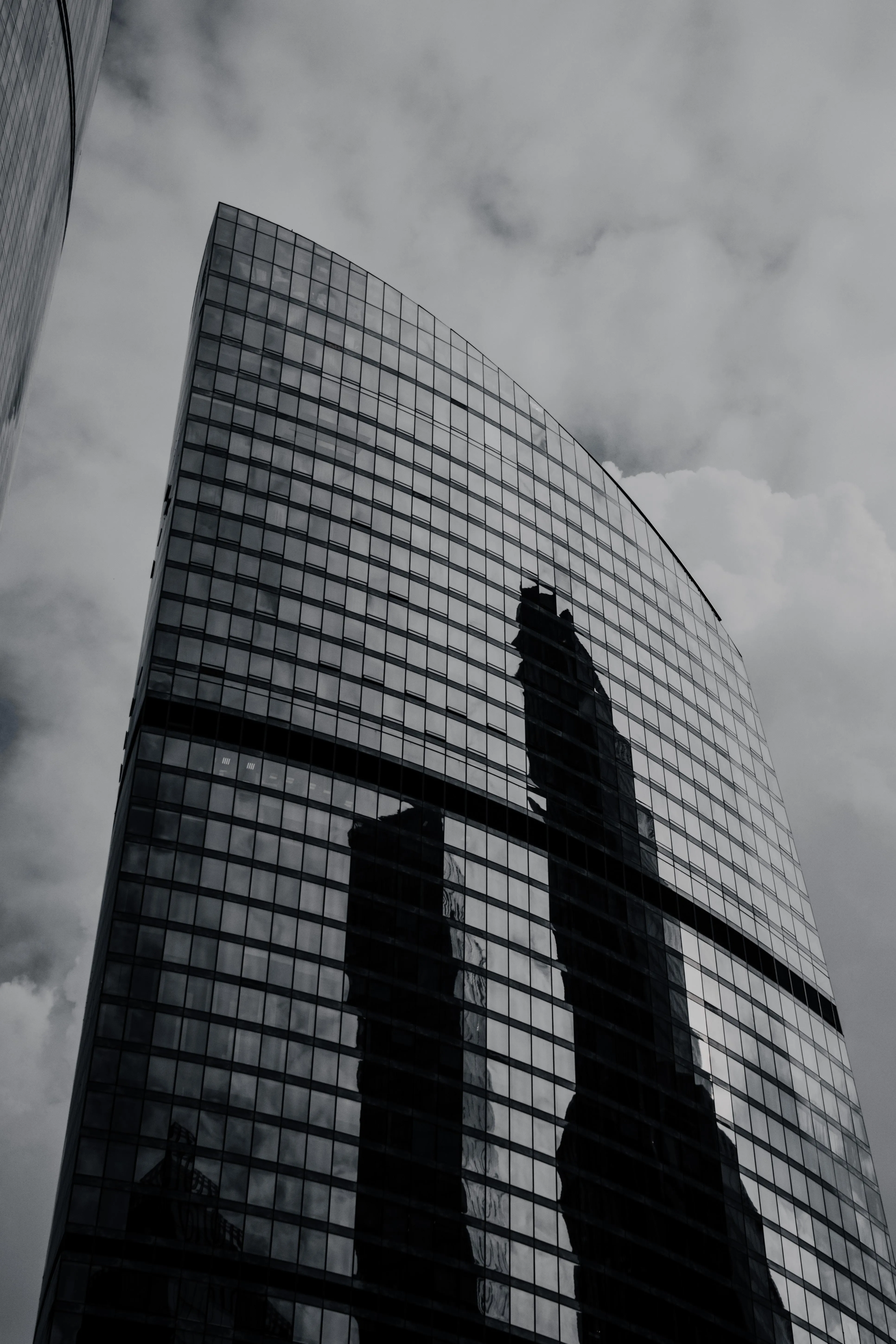 Black and White Modern Skyscraper with Dramatic Shadows