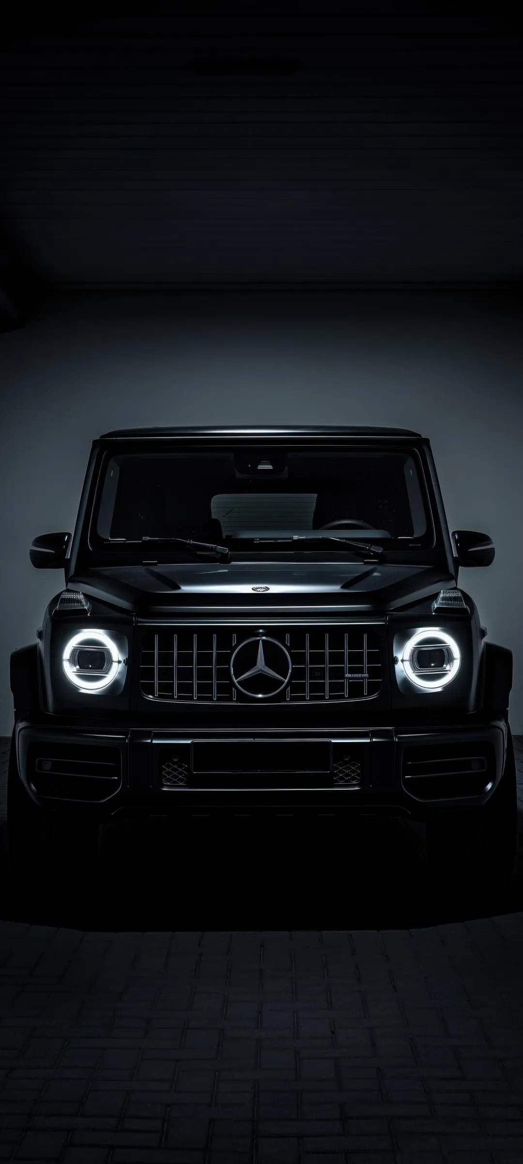 Black Car Front View in Dramatic Low Light Style Wallpaper