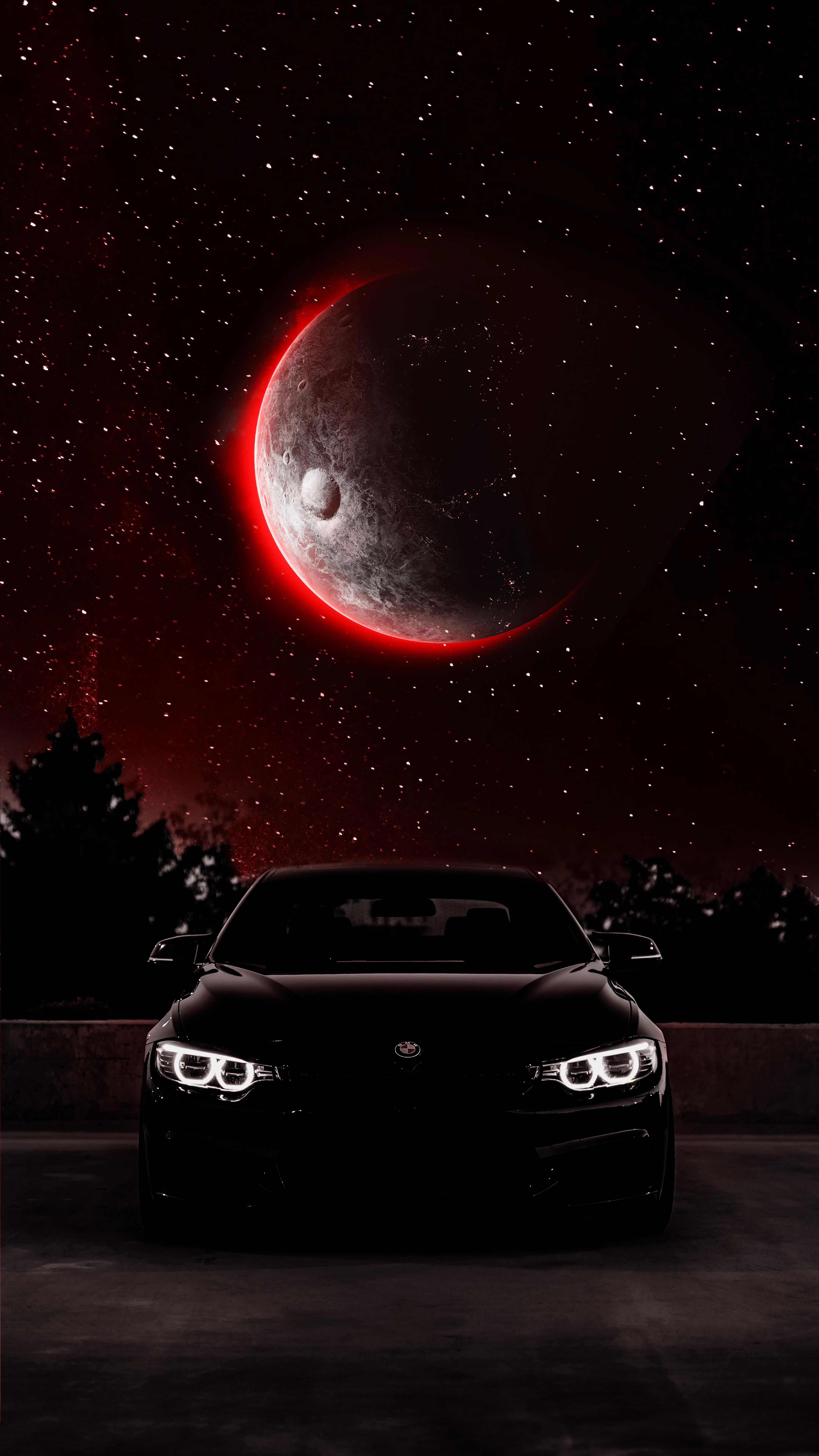 Black Car Parked Under a Red Moon in a Dark Night Sky