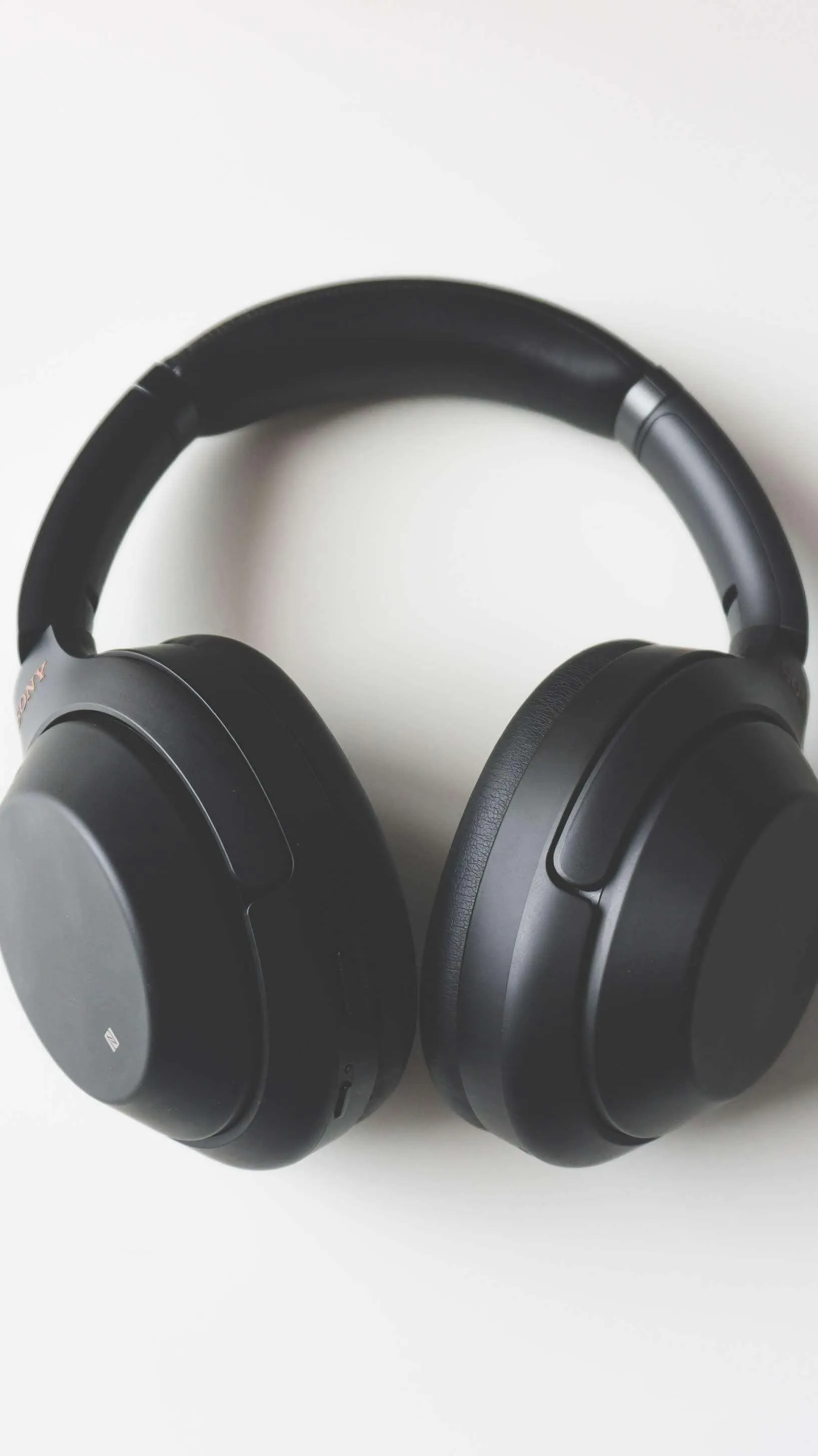 Black Headphones on Clean White Background Surface