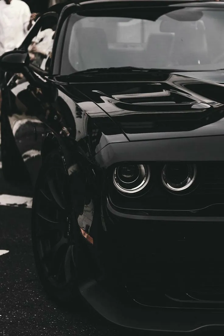 Black Luxury Car Headlights Glowing With Power Wallpaper