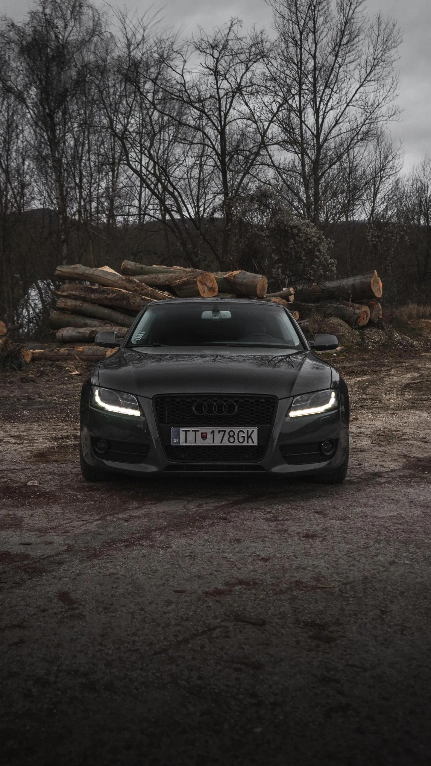 Black Luxury Car Parked on Street at Night Wallpaper