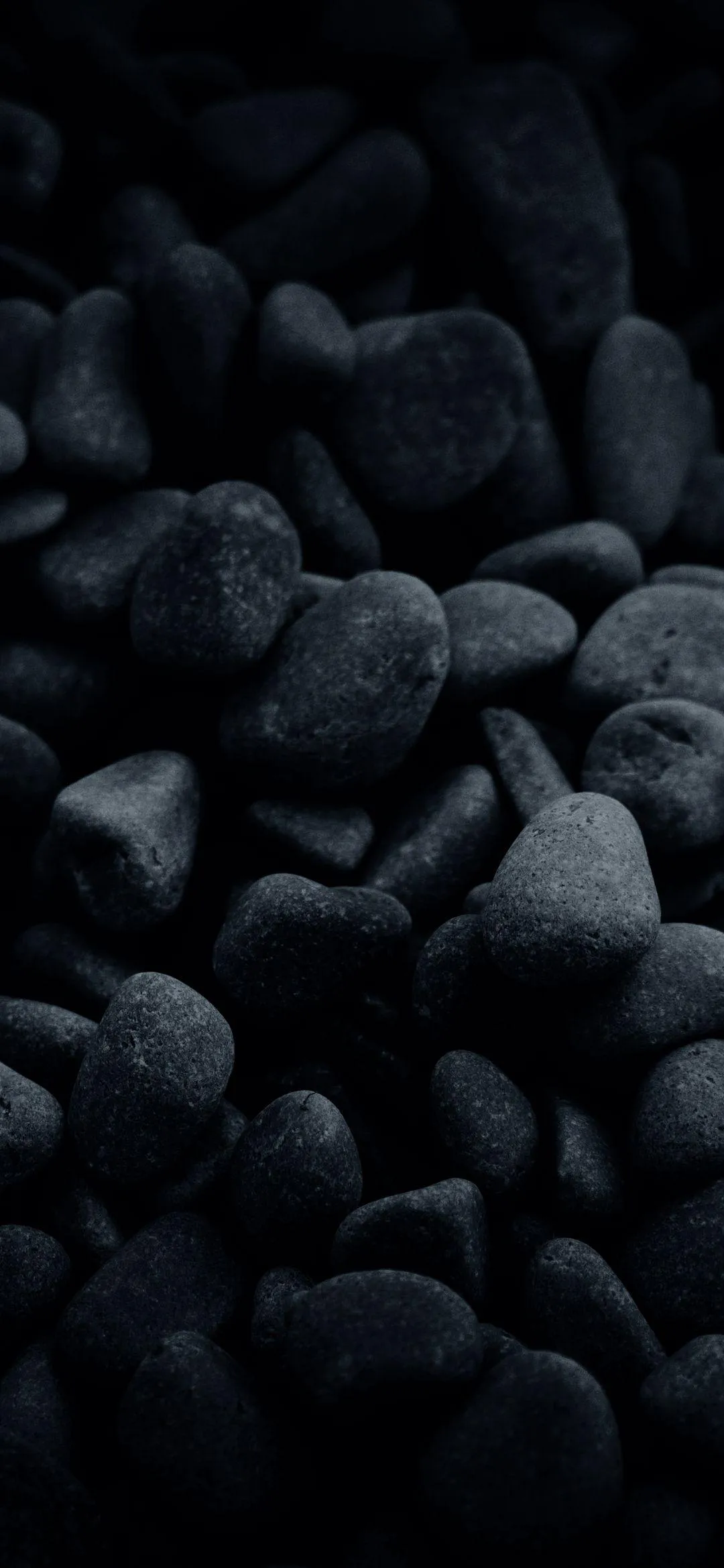 Black Smooth Stones Creating a Minimal Natural Texture