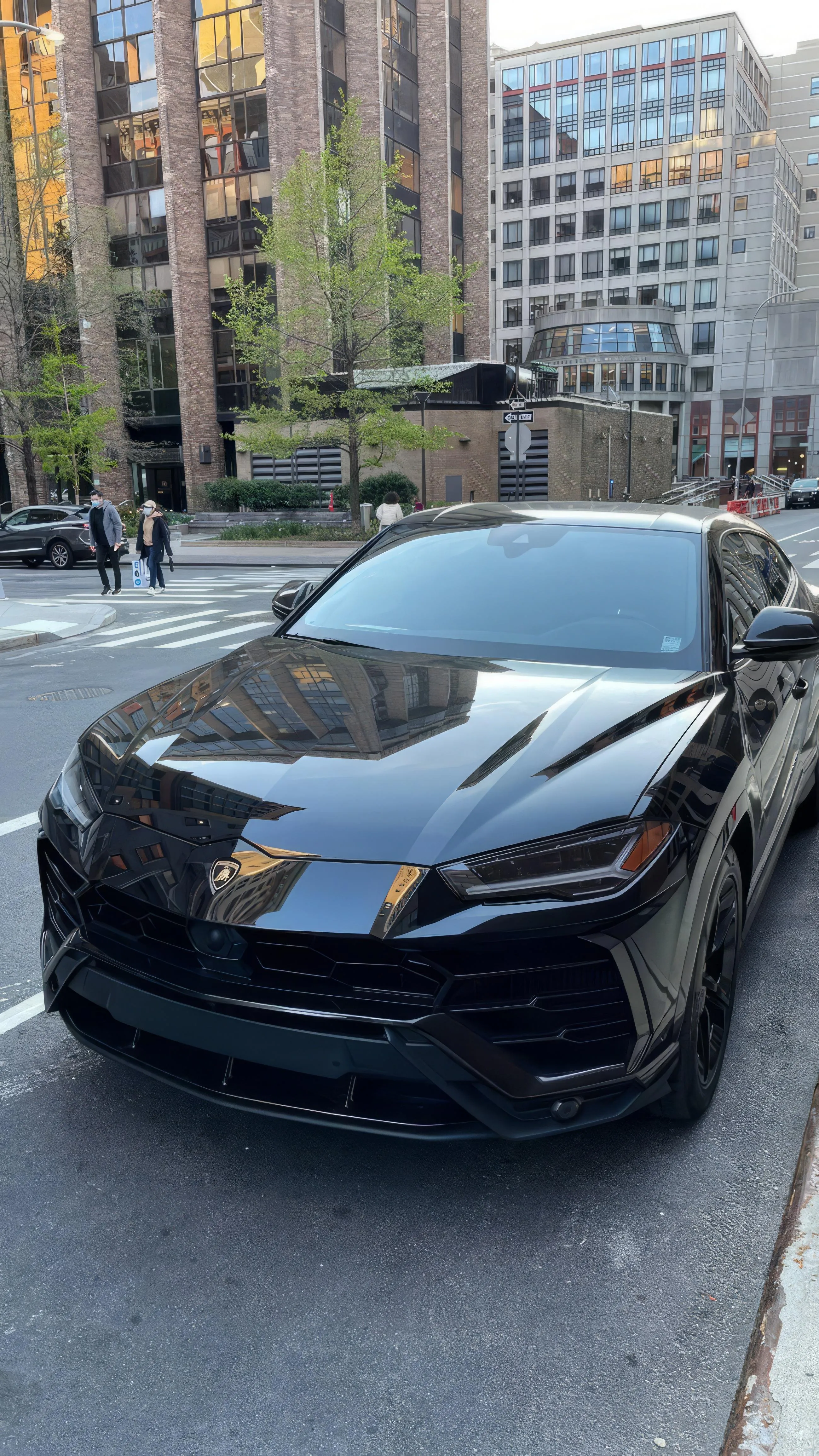 Black Sports Car Parked on City Street in Daylight Wallpaper