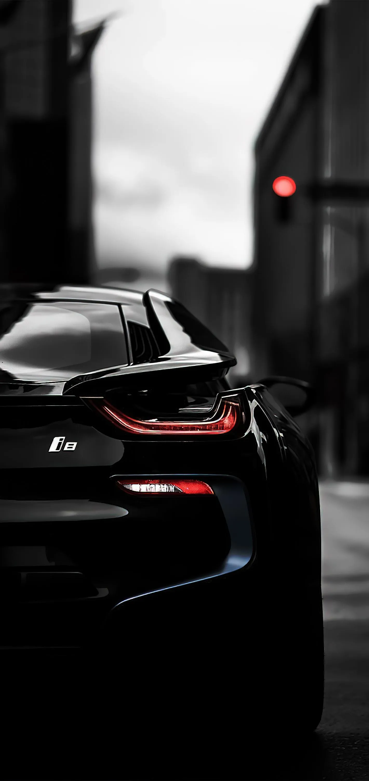 Black Sports Car Parked on Urban Street at Night Wallpaper