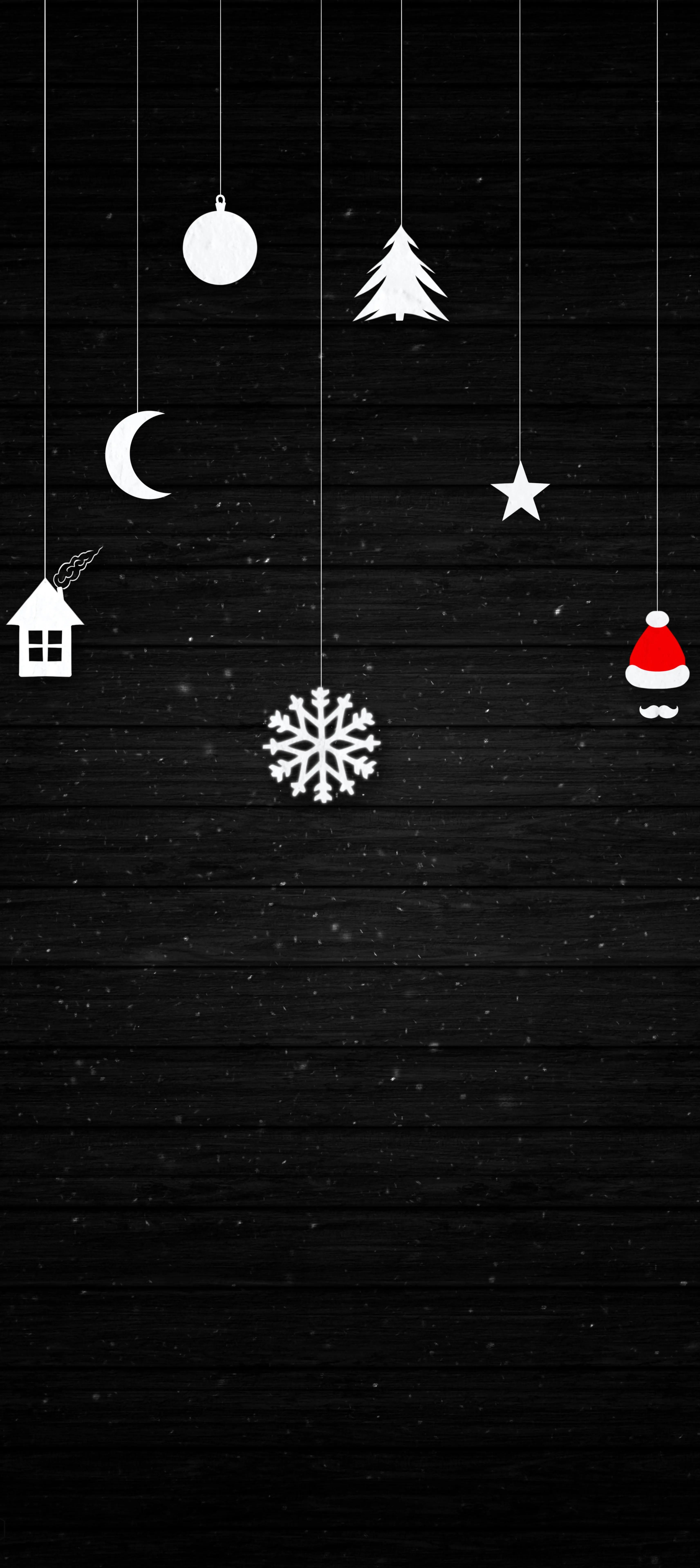 Black Wall with Hanging White Christmas Ornaments and Stars