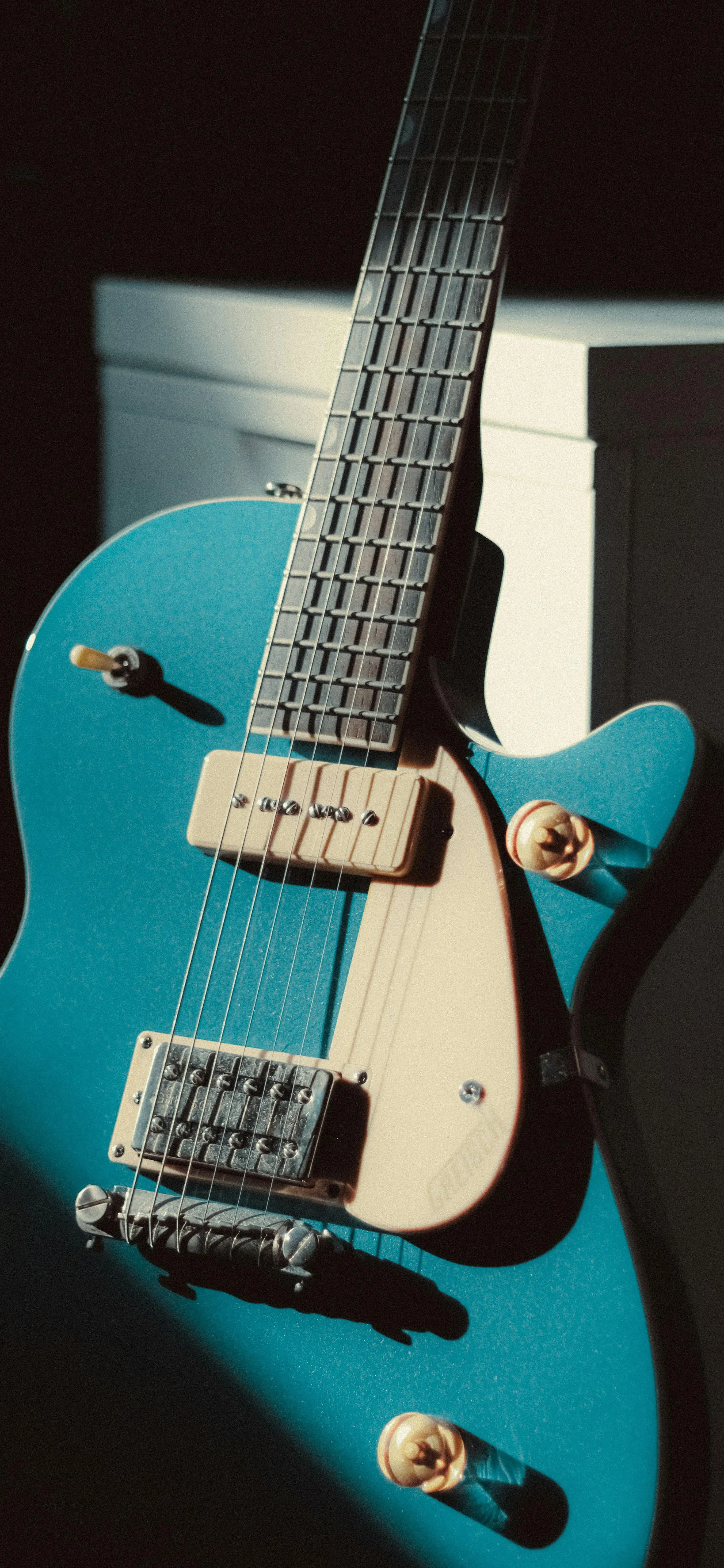 Blue Electric Guitar Positioned on White Background