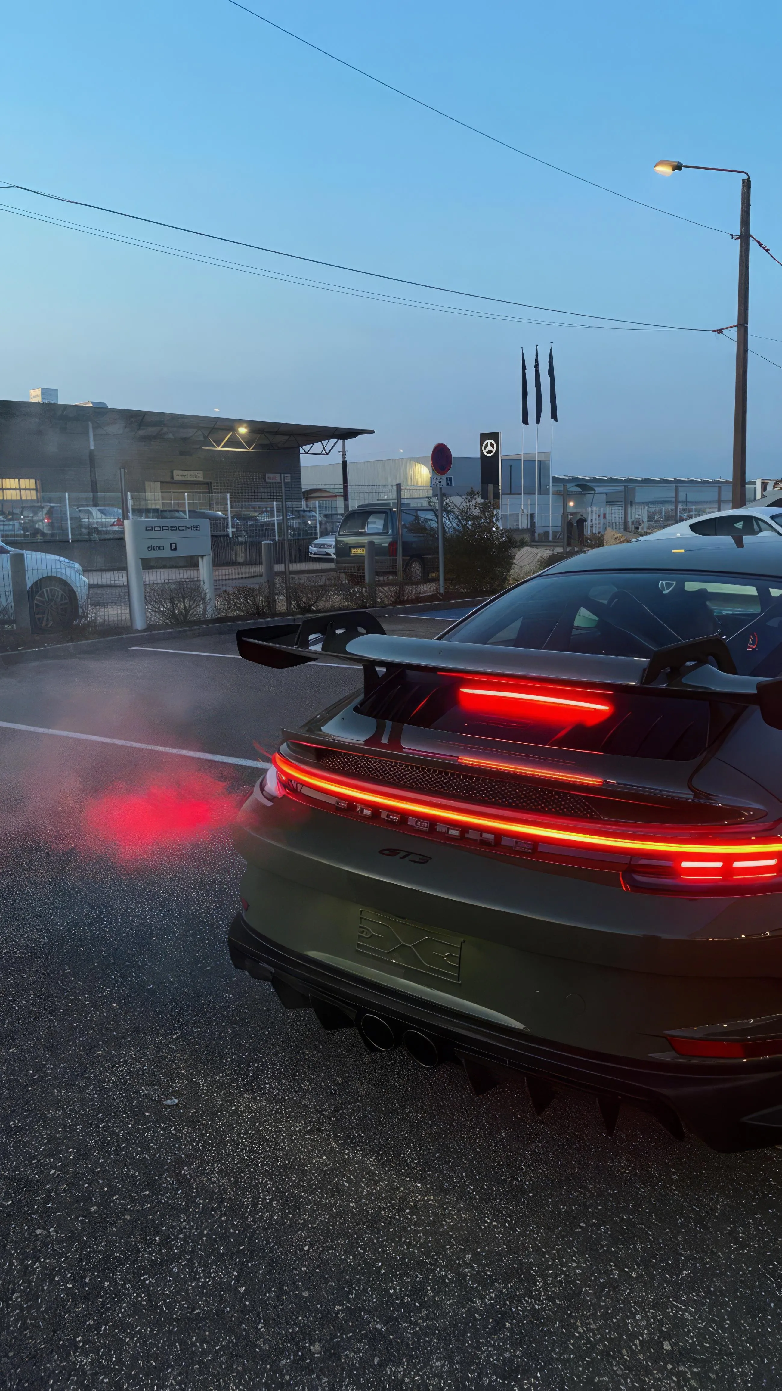 Blurred Sports Car Driving Fast in Evening Traffic Image