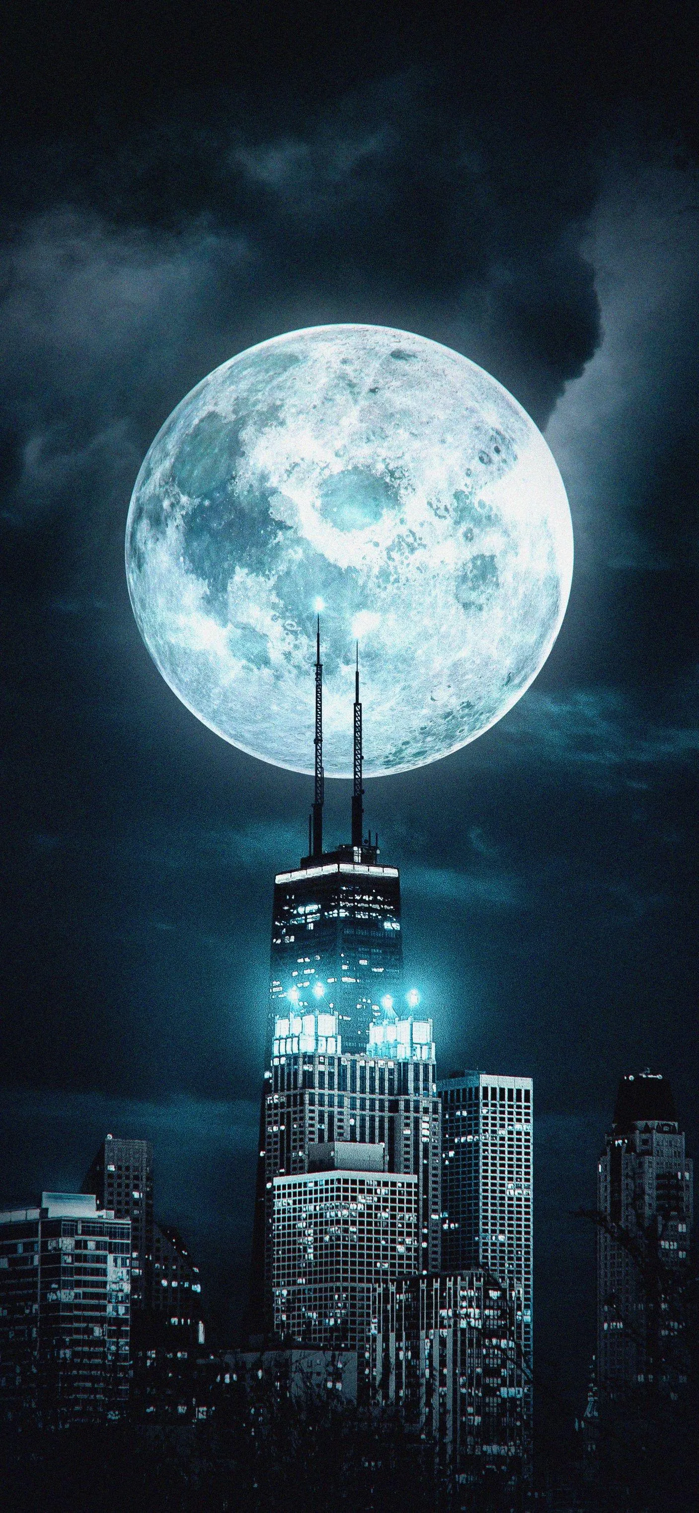 Bright Full Moon Shining Over a Calm Nighttime Cityscape