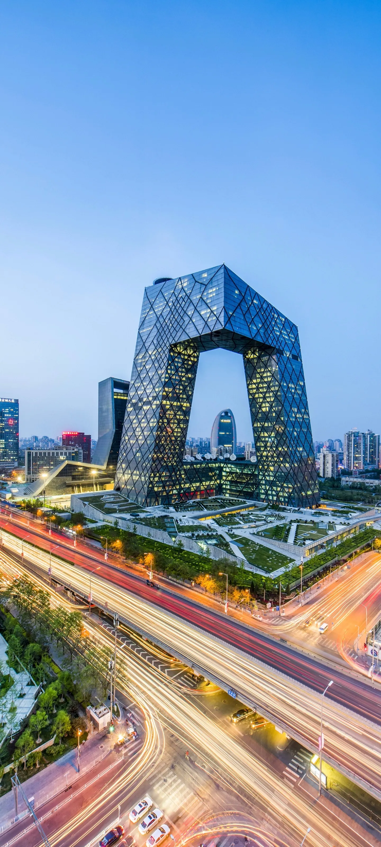 Busy Highway Passing Modern Skyscraper in Cityscape Image