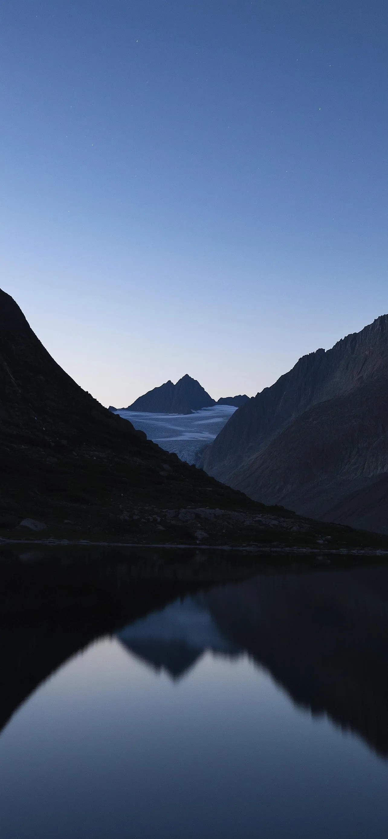 Calm Mountain and Lake Reflection under Clear Blue Sky