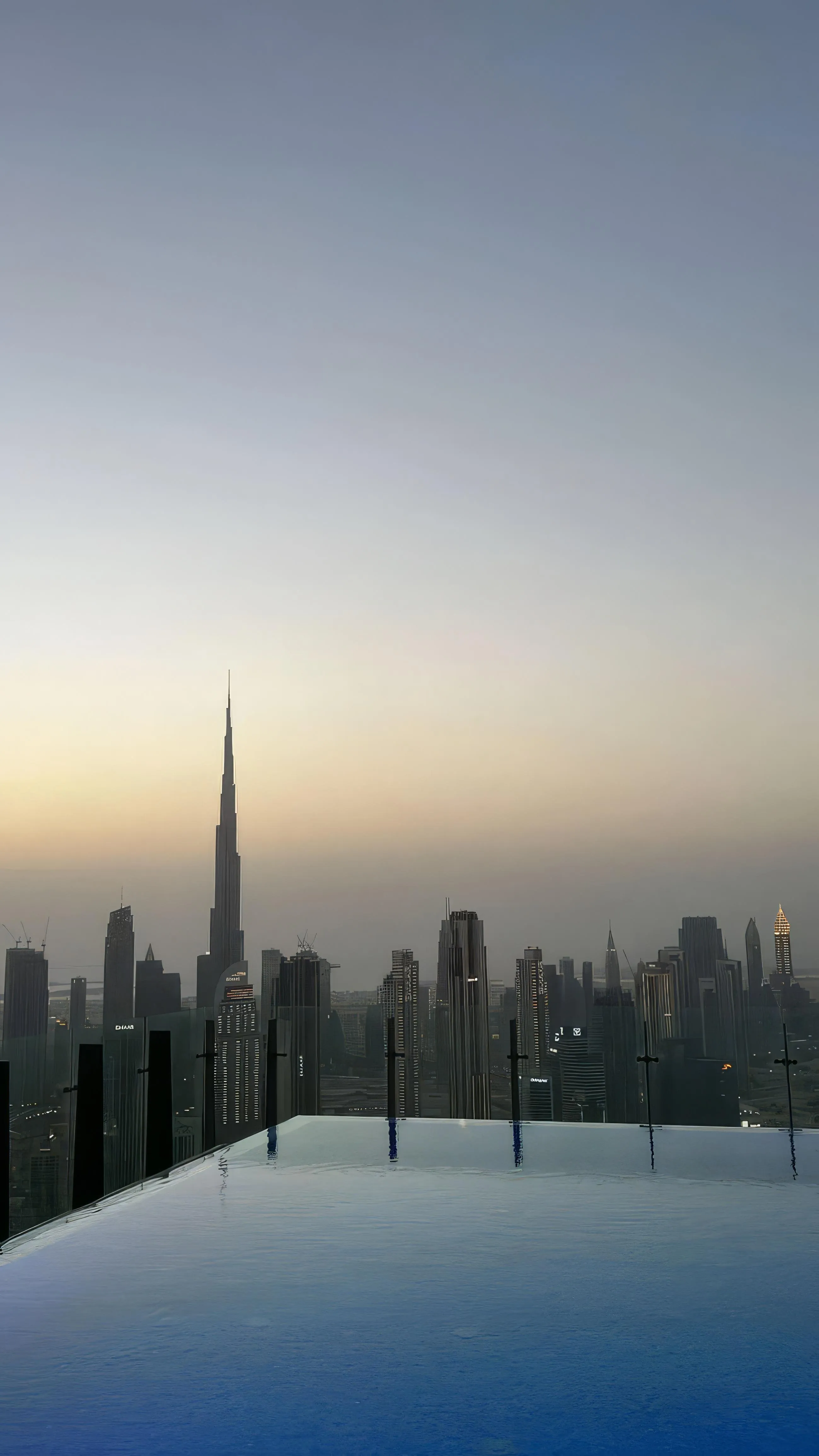 City Skyline at Sunrise with Tall Skyscrapers and Fog