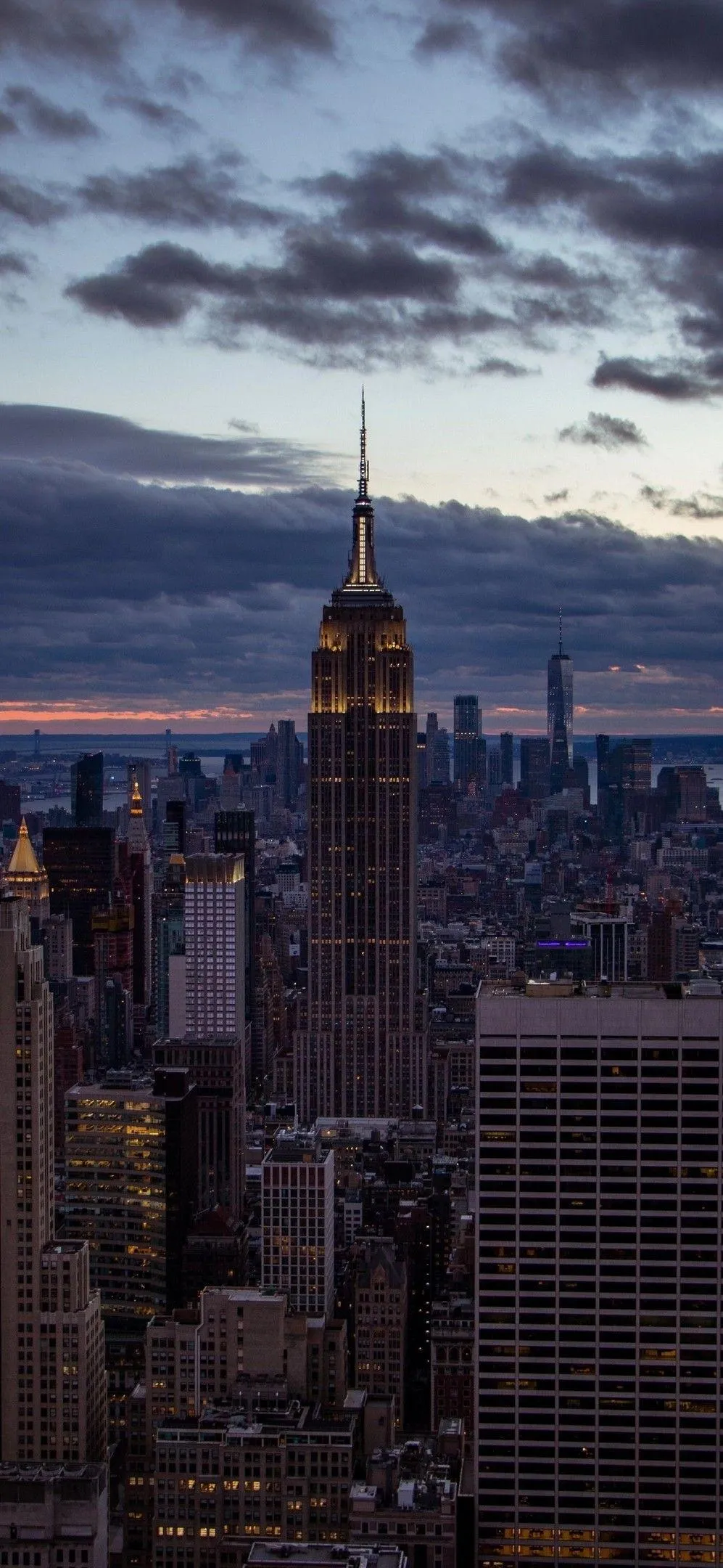 City Skyline Glowing Under Soft Evening Golden Hour Sky