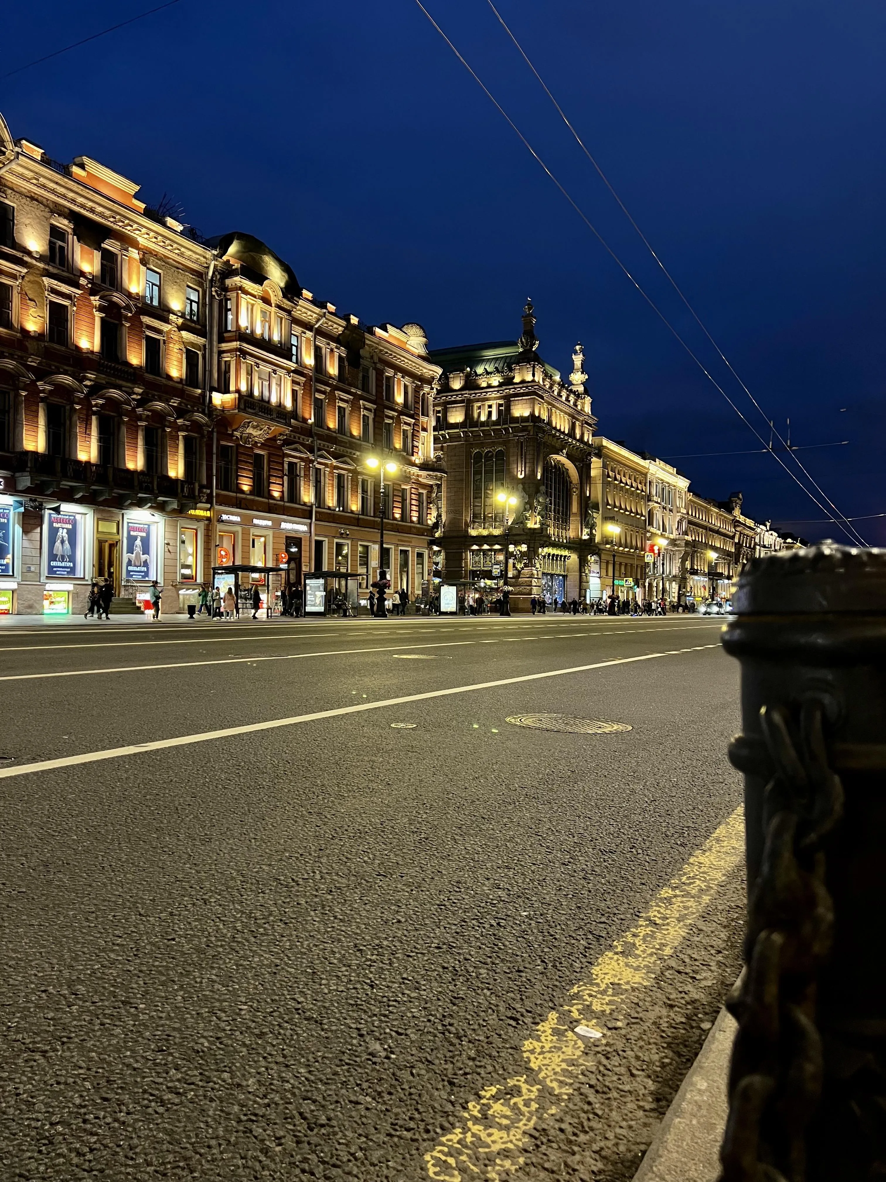 City Street at Night with Architecture and Street Lights