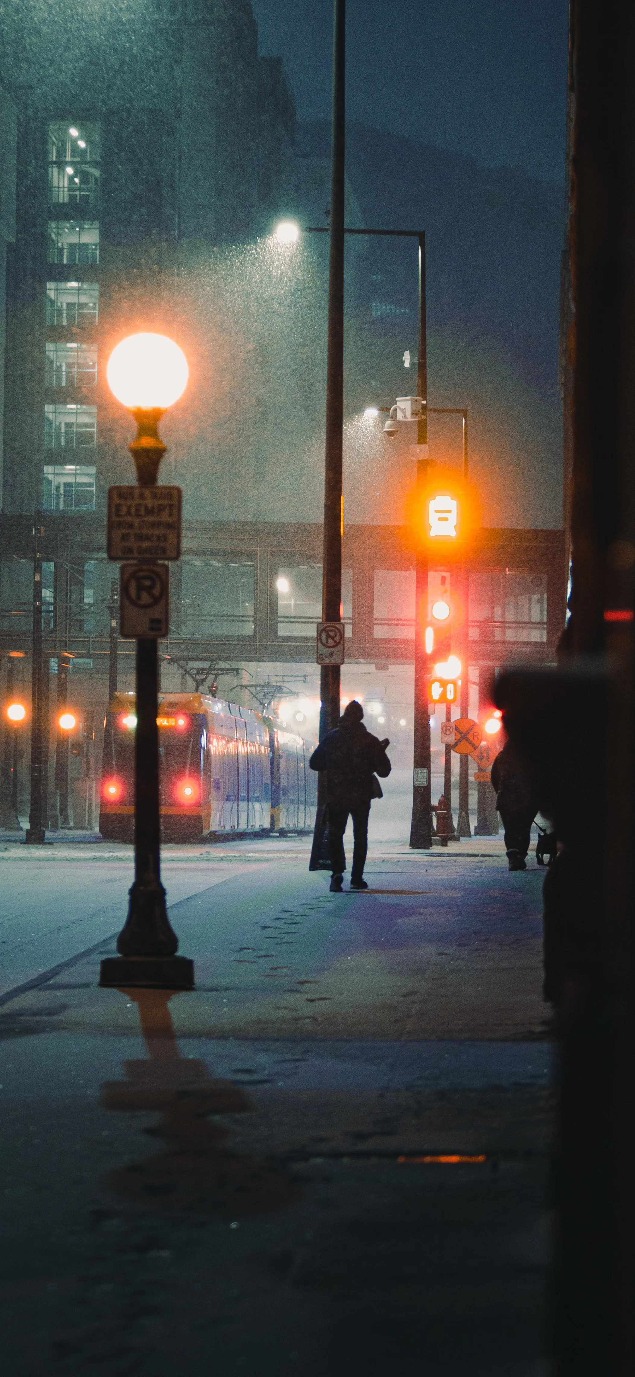 City Street at Night with Lamps and People Walking Free Image