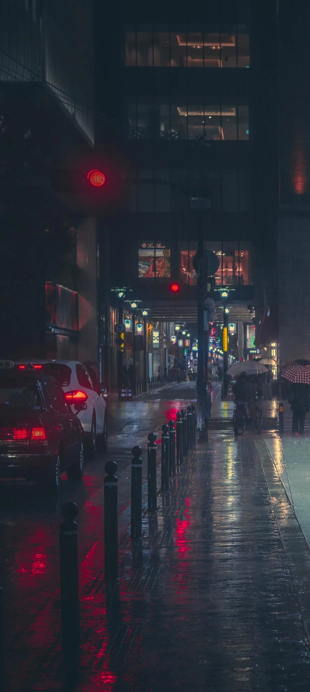 City Street Reflections on Wet Pavement at Night Wallpaper