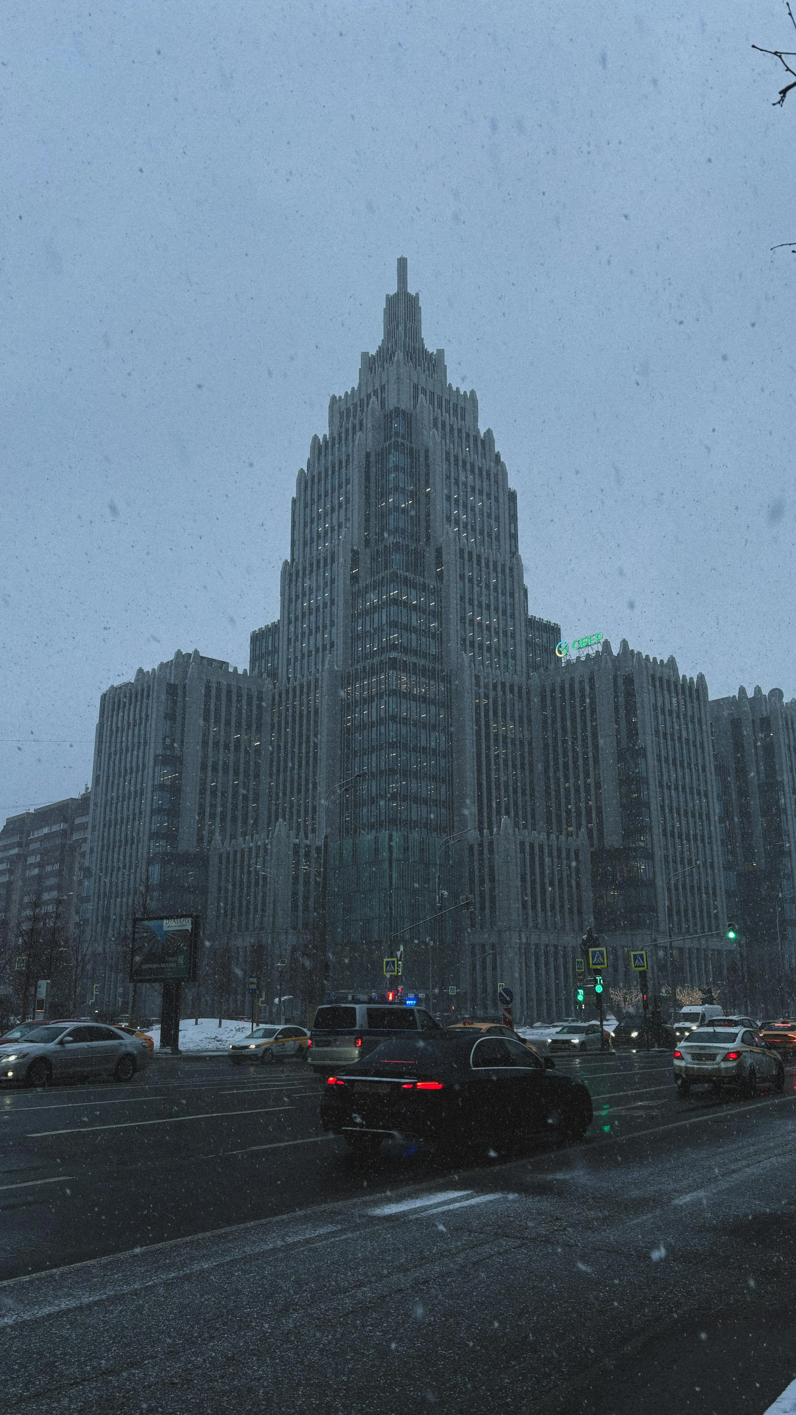 City Street Scene with Tall Buildings and Rainy Weather View