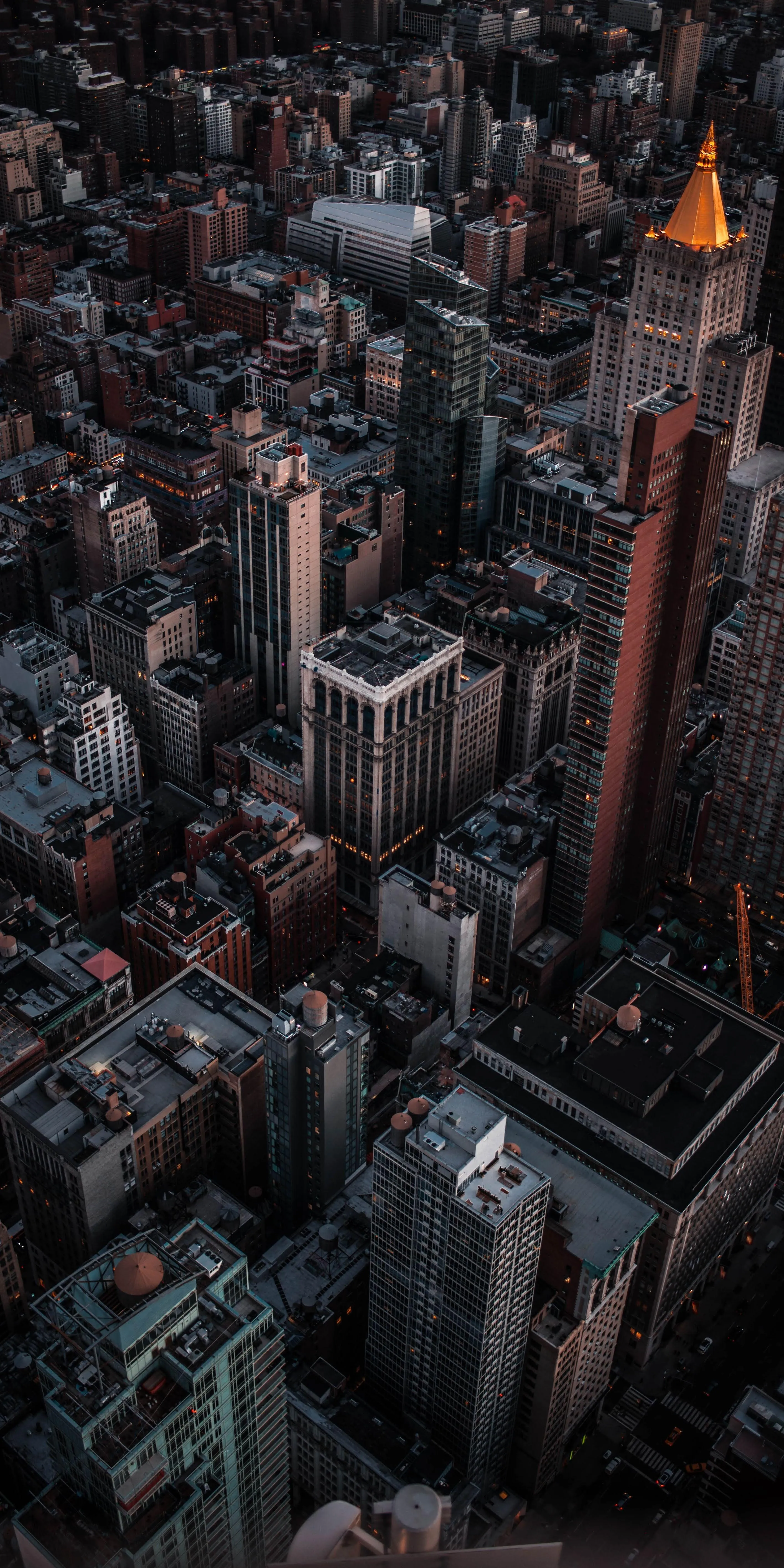 Cityscape View of Skyscrapers and Urban Streets at Night