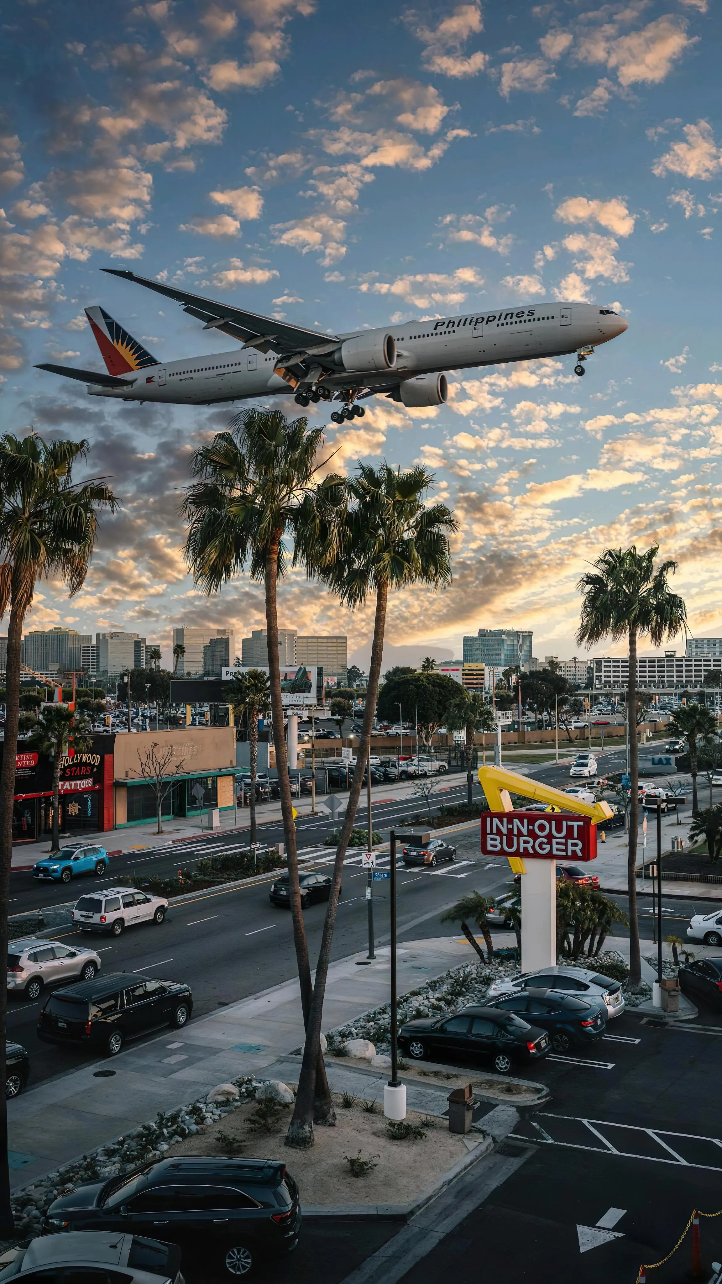Cityscape with Airplane Flying Over at Sunset Time Image
