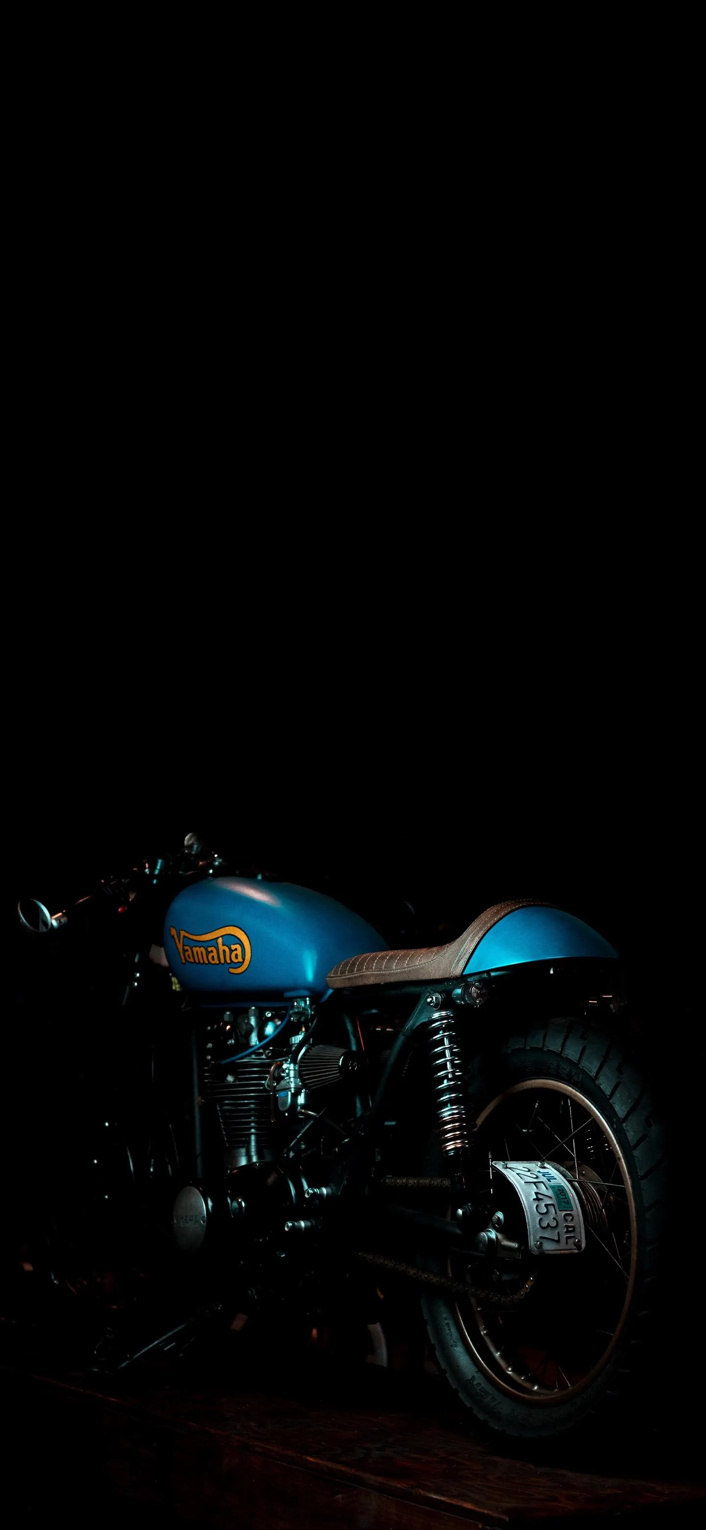 Classic Blue Motorcycle in Night Urban Lighting Wallpaper