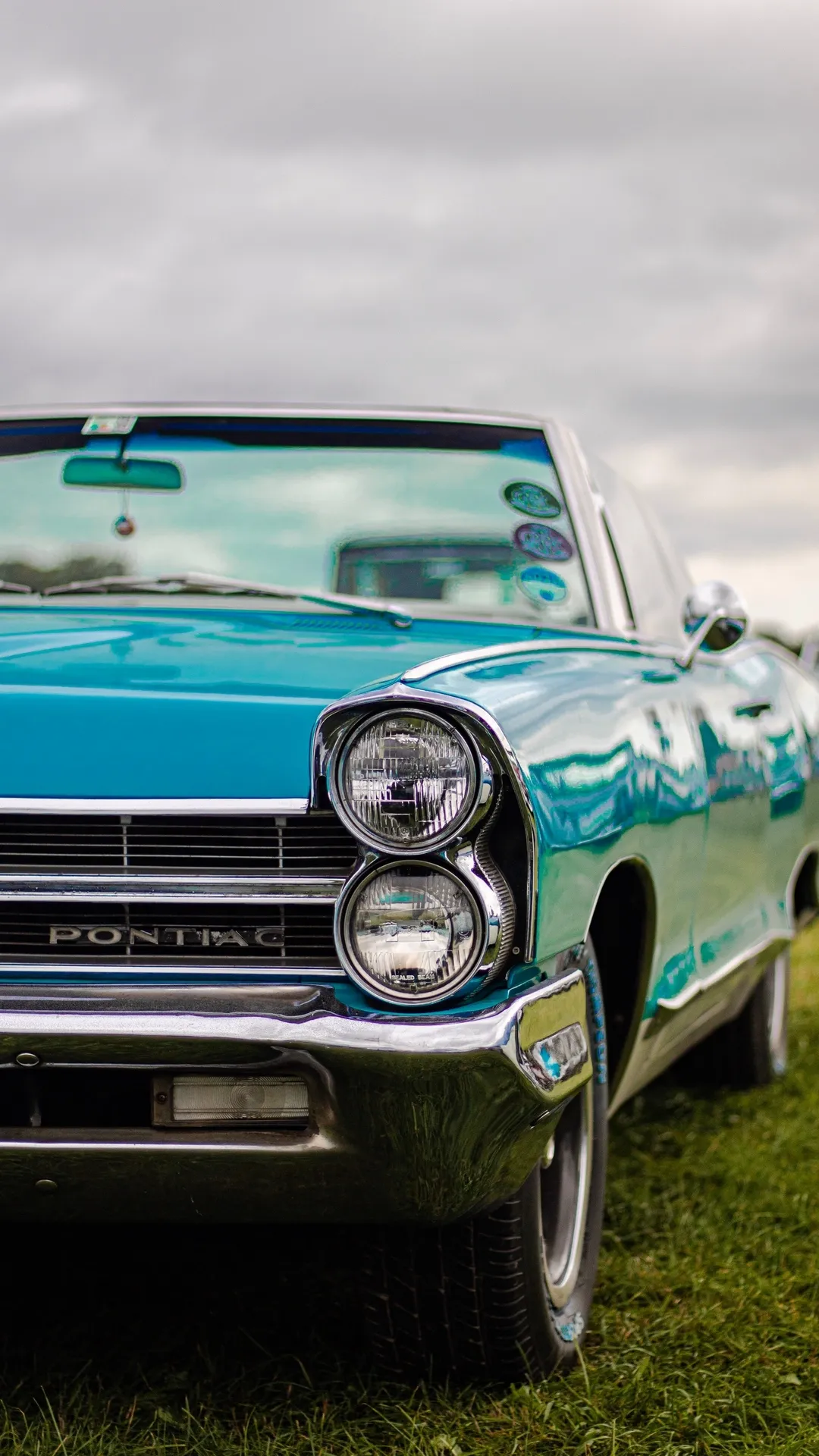 Classic Blue Vintage Car Parked on Green Lawn Wallpaper